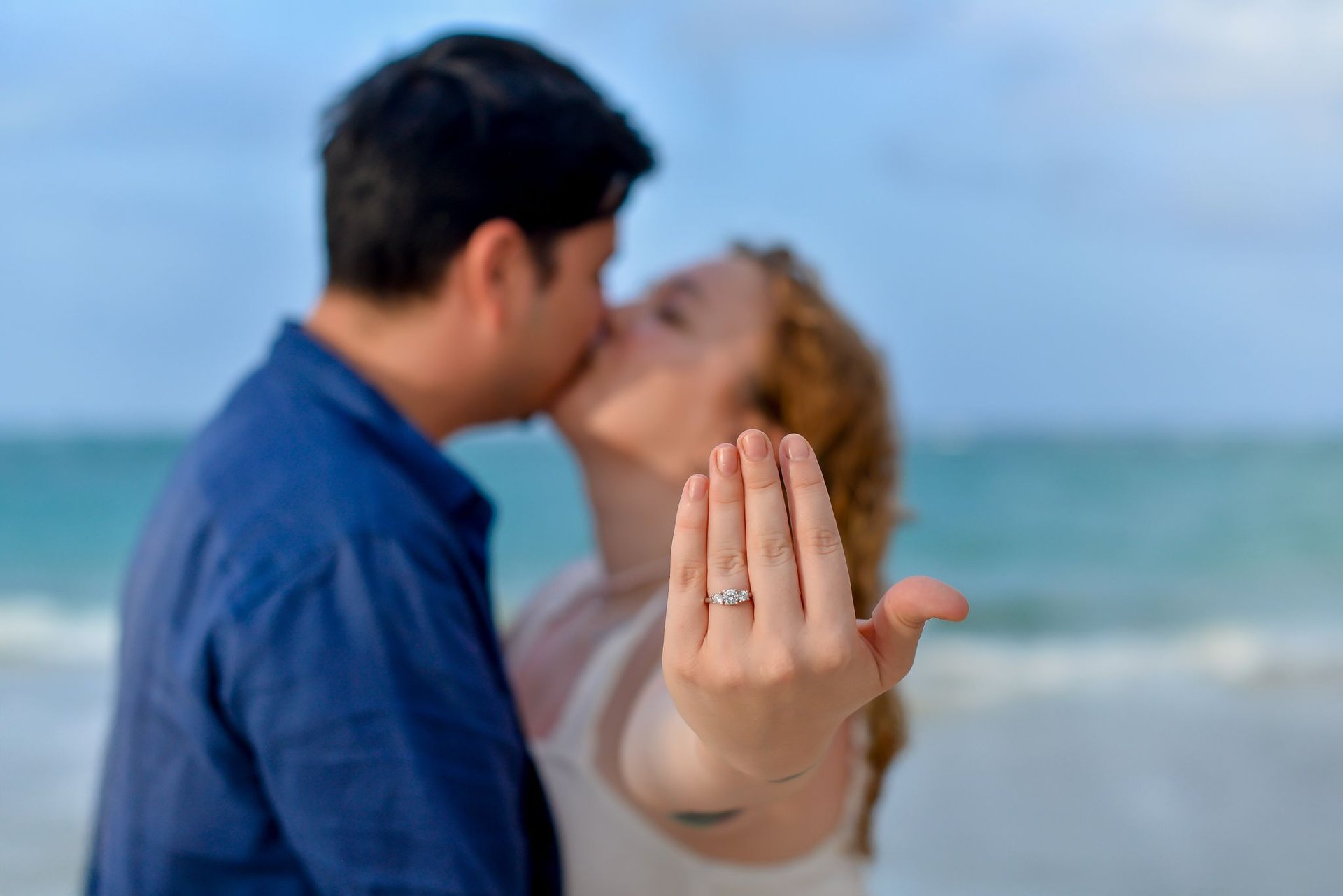 couple wearing silver-colored rings
