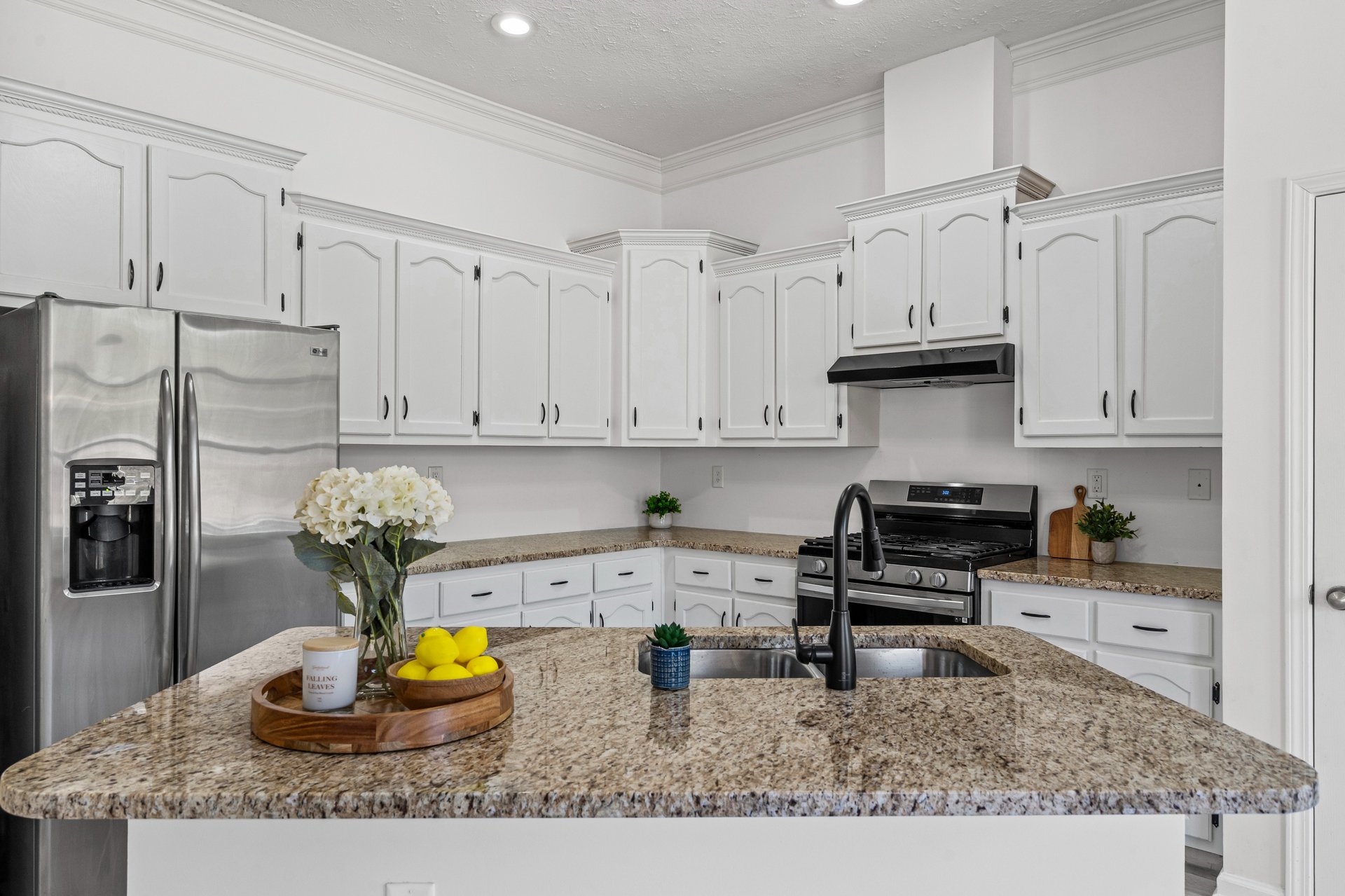 brown and white cardboard boxes on white wooden shelf