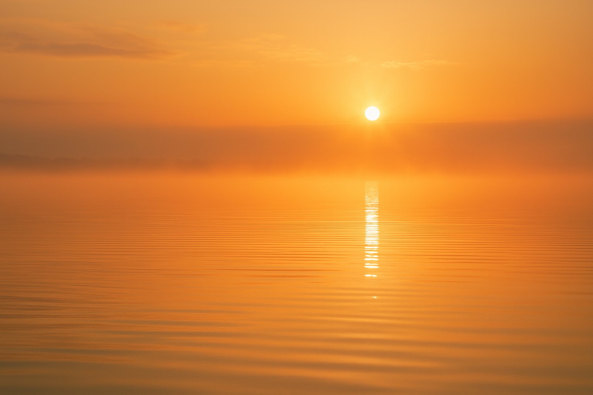 woman wearing yellow long-sleeved dress under white clouds and blue sky during daytime