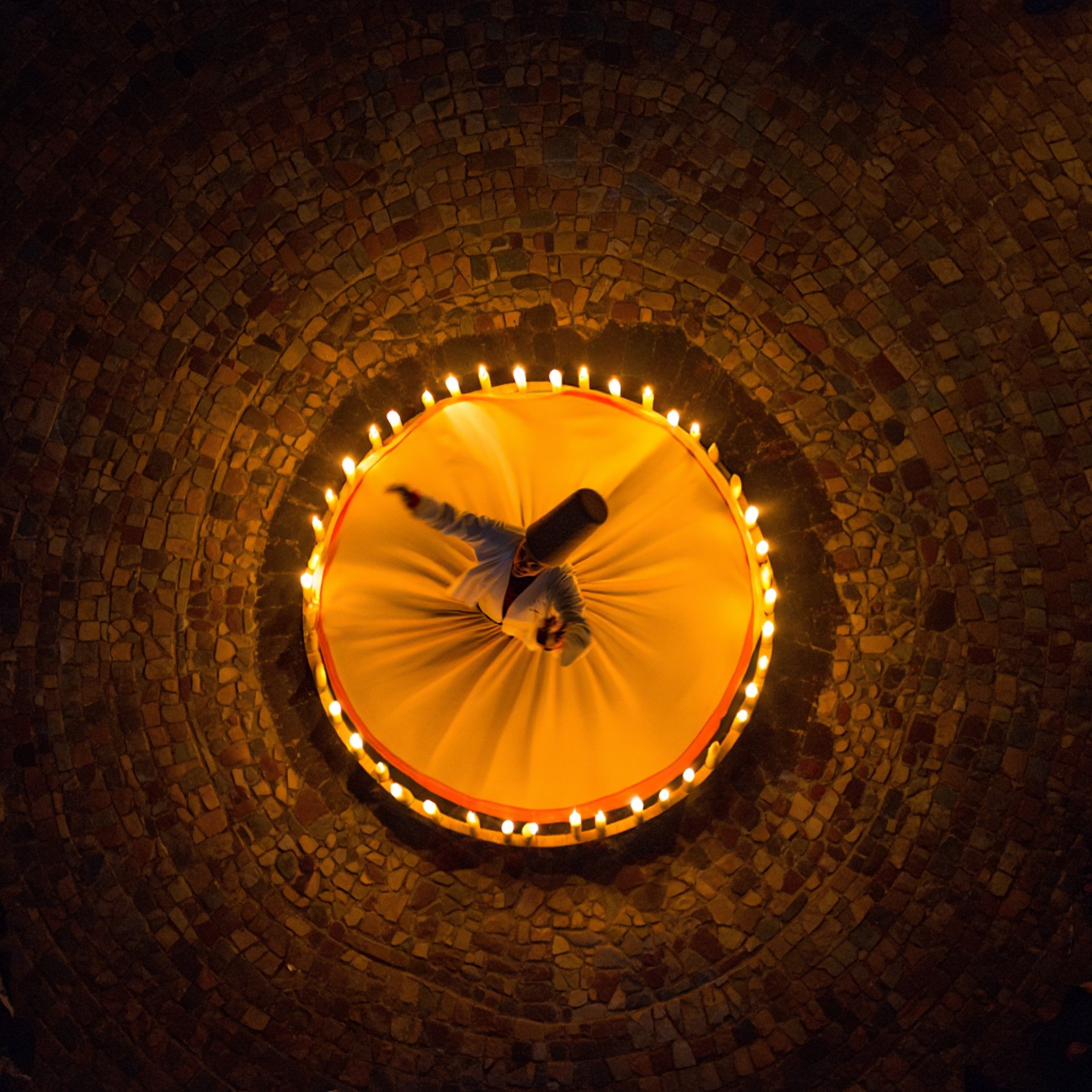  Aerial view of spinning dervish creating spiral patterns