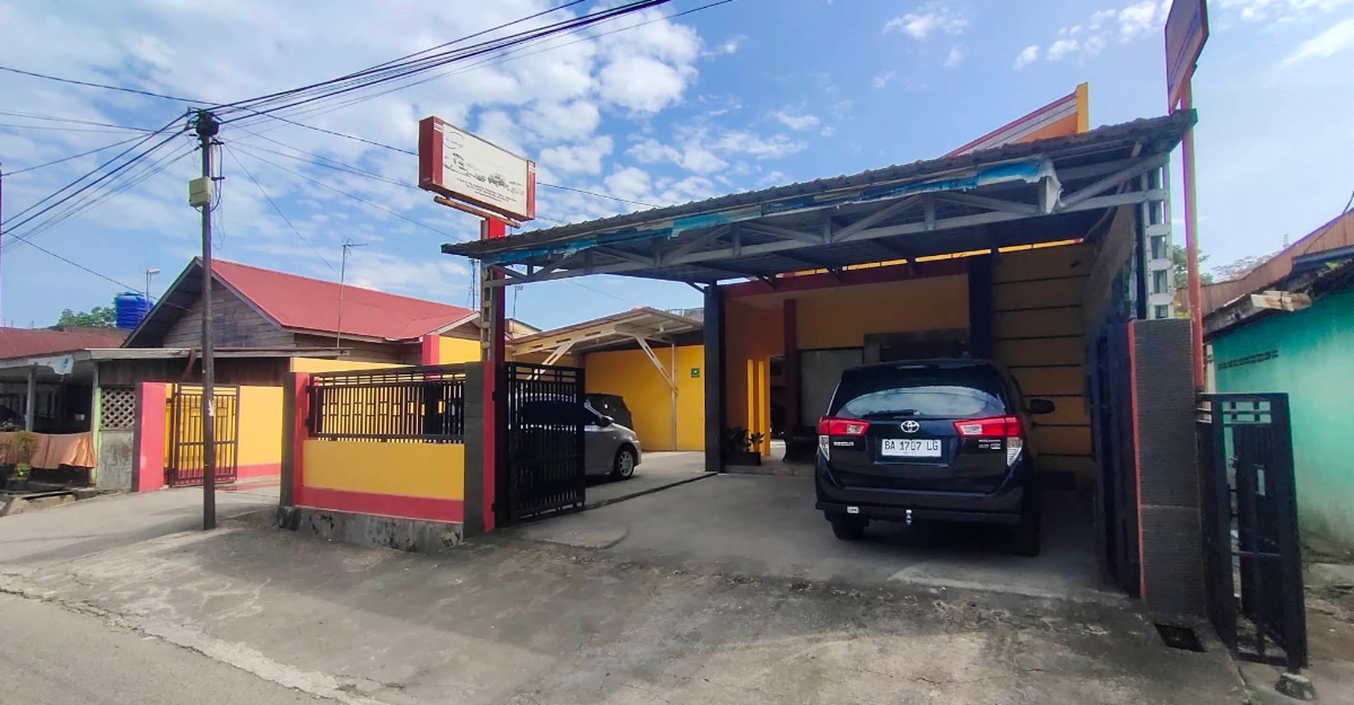 woman wearing yellow long-sleeved dress under white clouds and blue sky during daytime