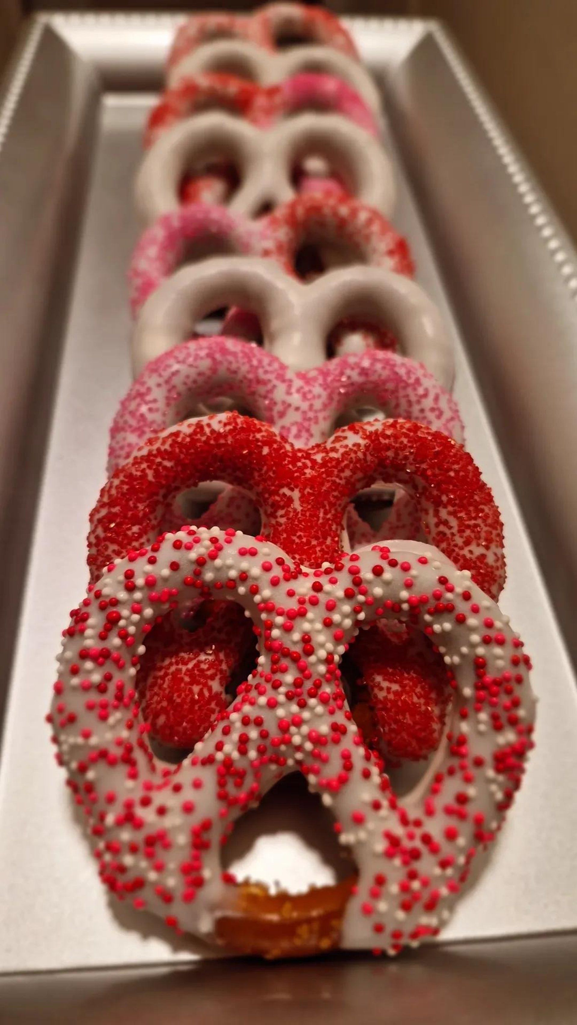an abstract photo of a curved building with a blue sky in the background