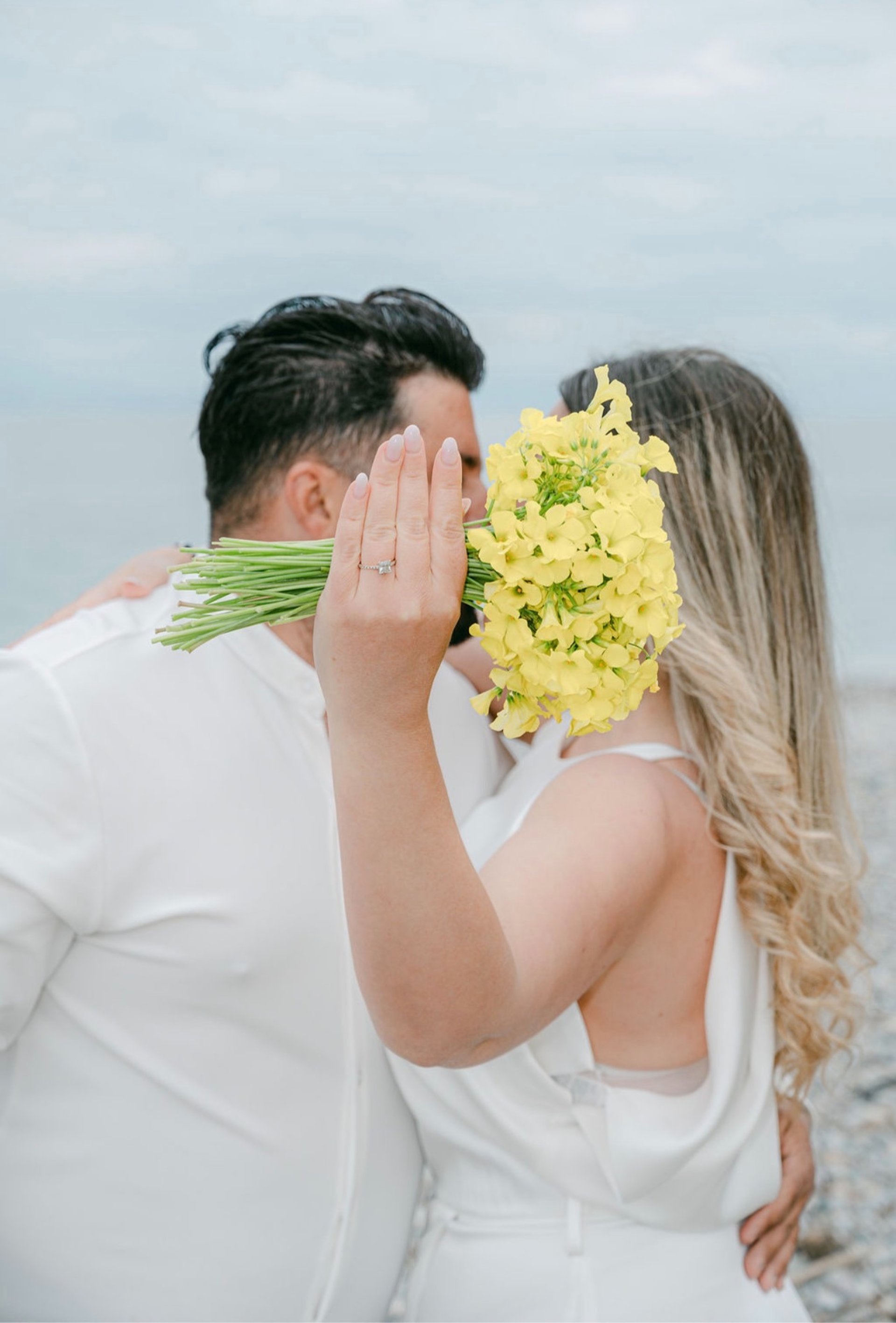 couple wearing silver-colored rings
