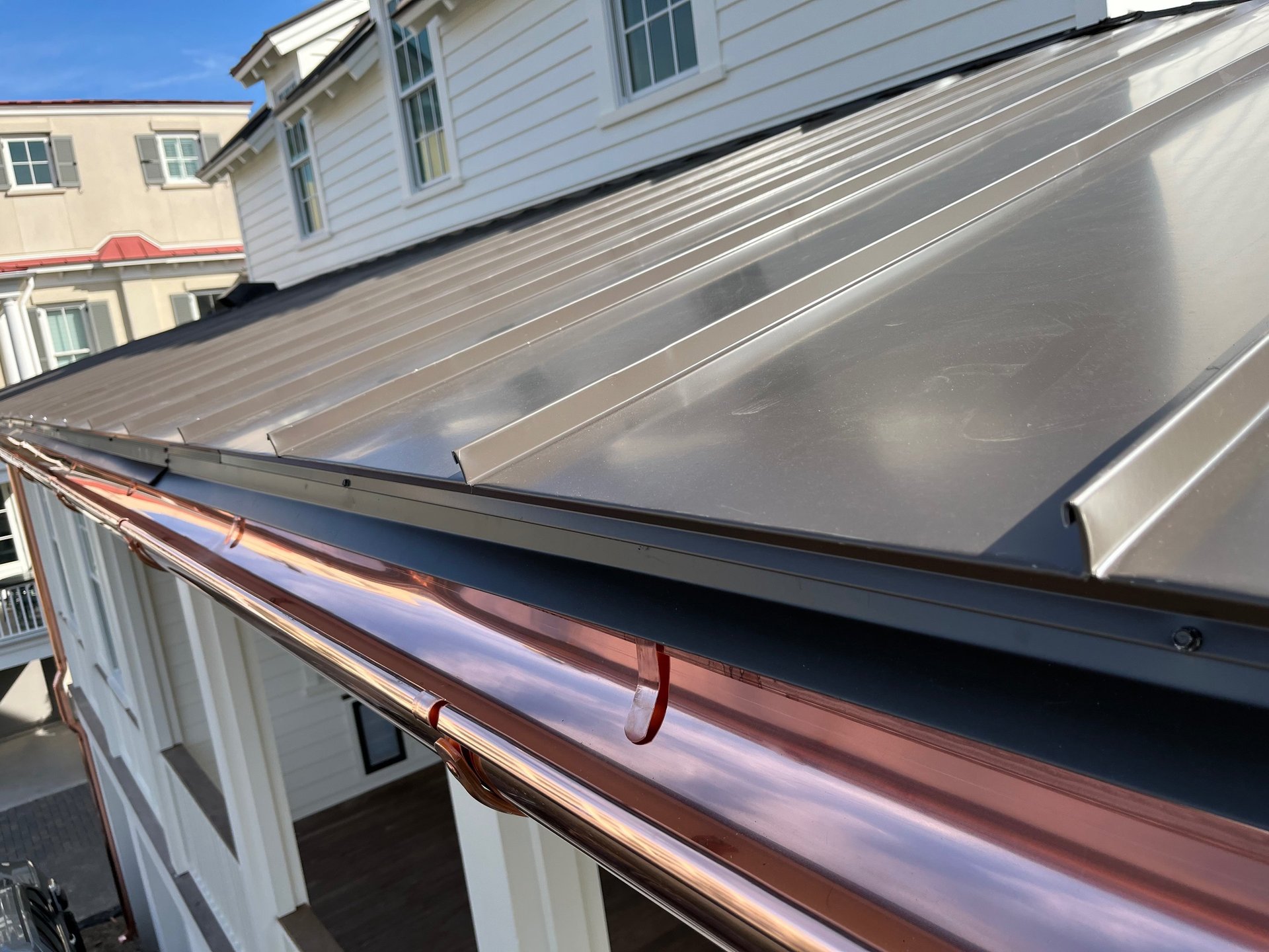 a brick house with a tree in front of it