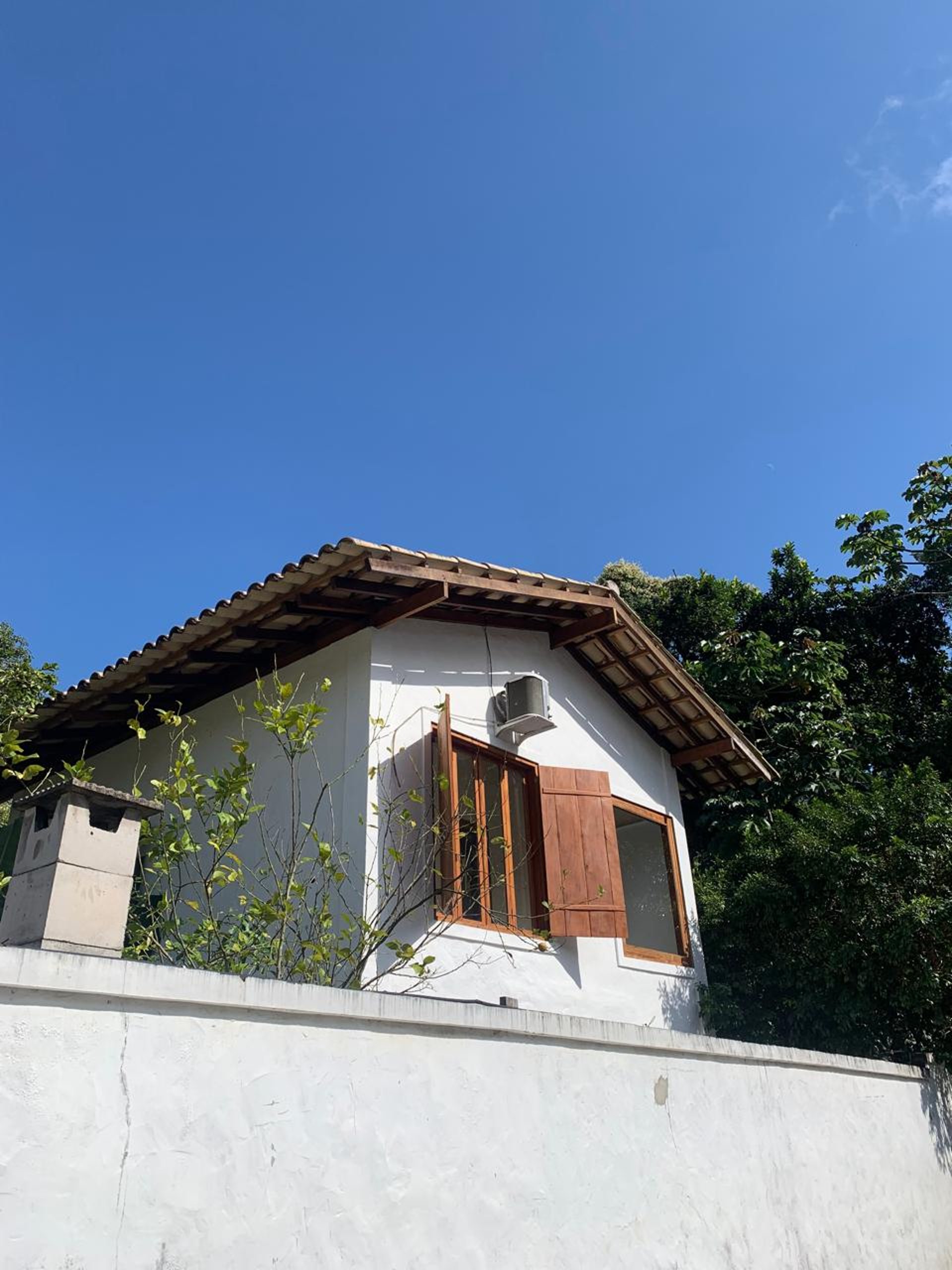 an abstract photo of a curved building with a blue sky in the background