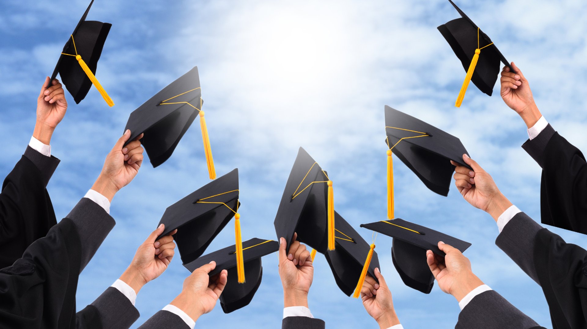 woman wearing yellow long-sleeved dress under white clouds and blue sky during daytime