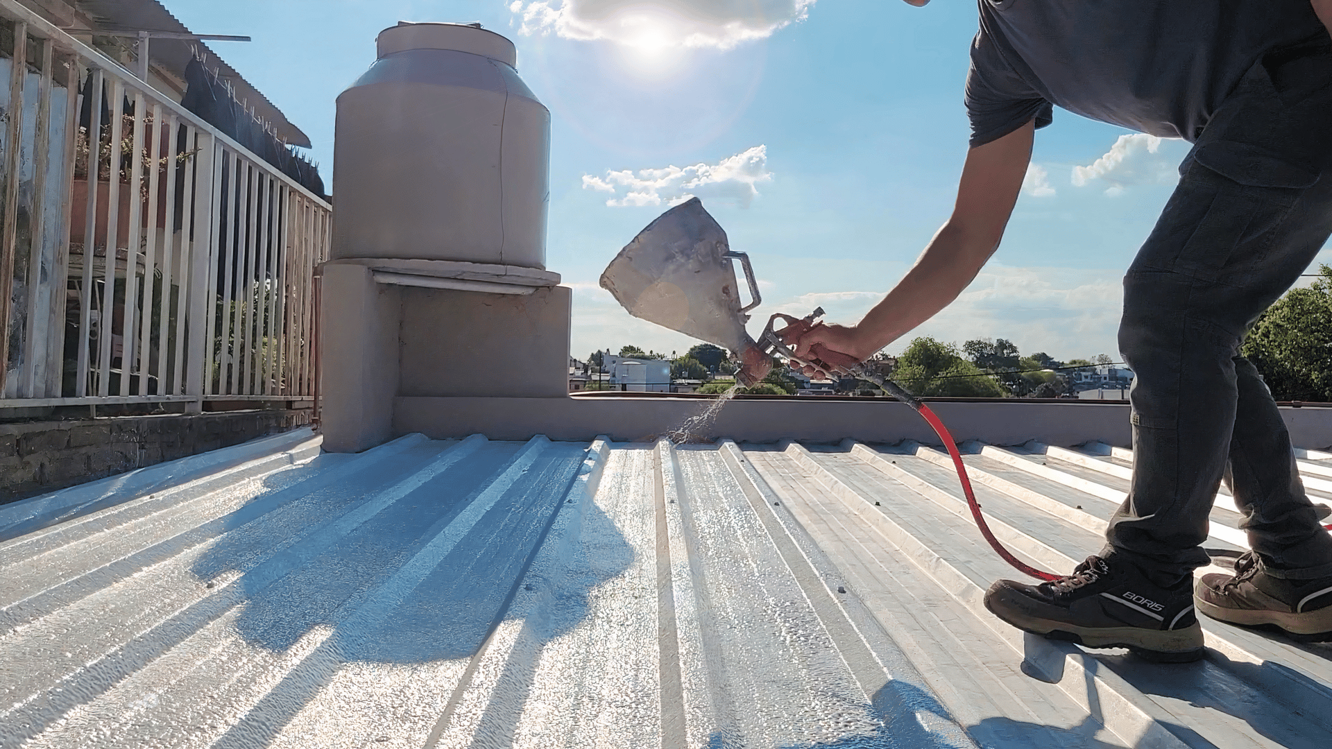 an abstract photo of a curved building with a blue sky in the background