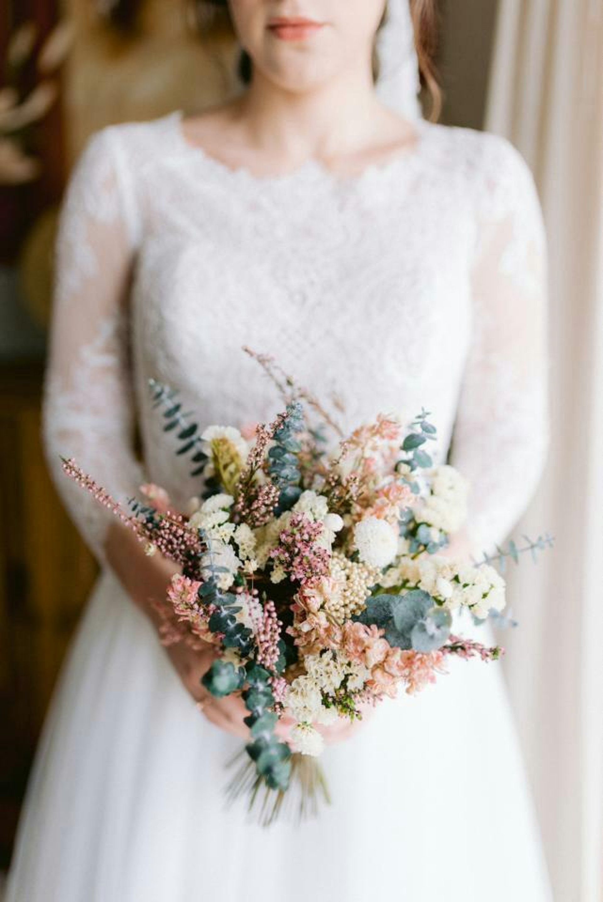 an abstract photo of a curved building with a blue sky in the background