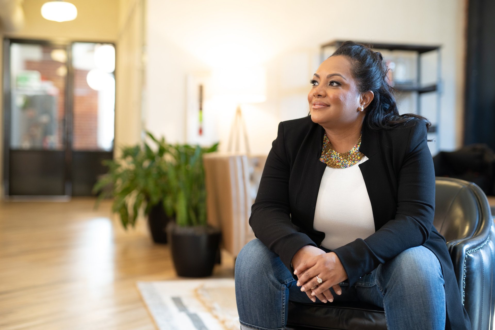 an abstract photo of a curved building with a blue sky in the background