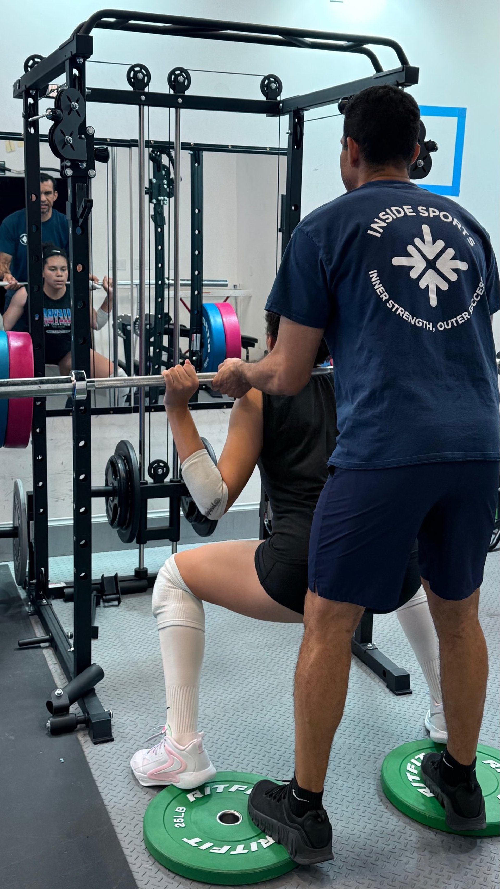 person holding barbell
