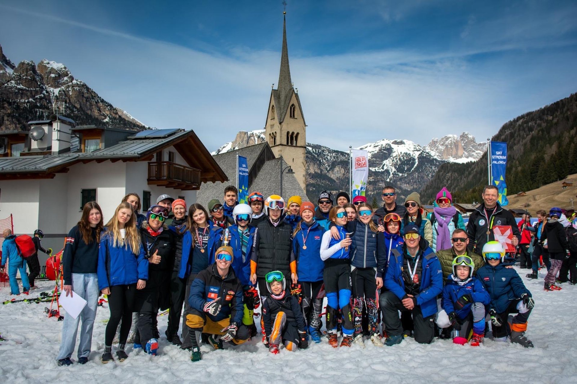 people walking near trees covered by snow at daytime