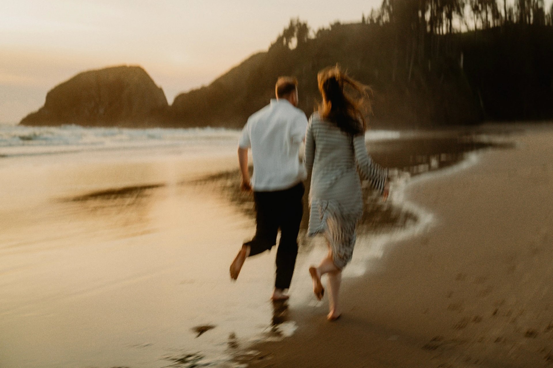 grayscale photography of groom and bride kissing on beach