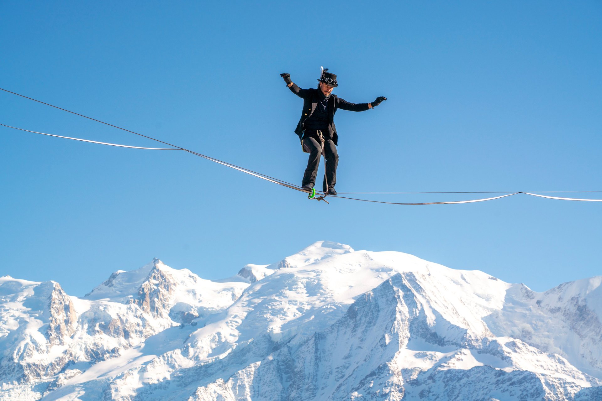 an abstract photo of a curved building with a blue sky in the background