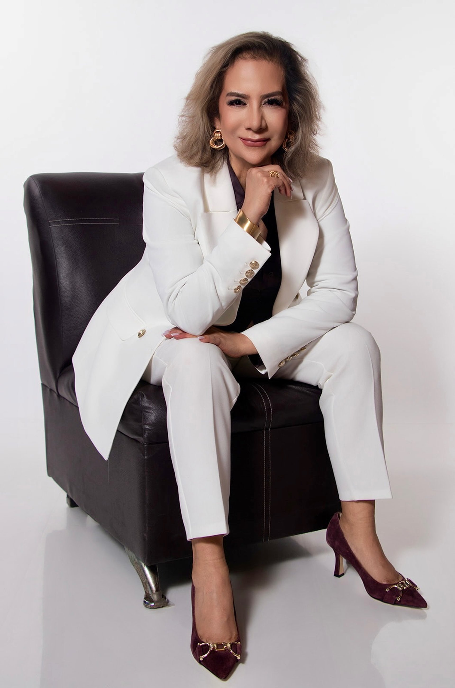 an abstract photo of a curved building with a blue sky in the background