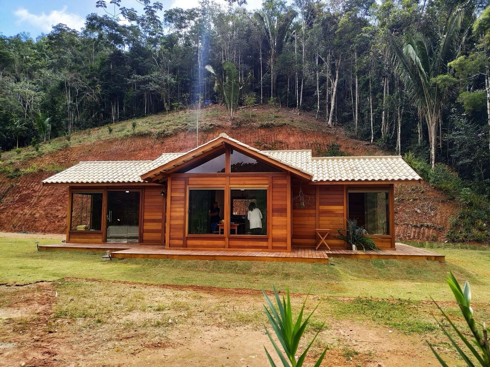 woman wearing yellow long-sleeved dress under white clouds and blue sky during daytime