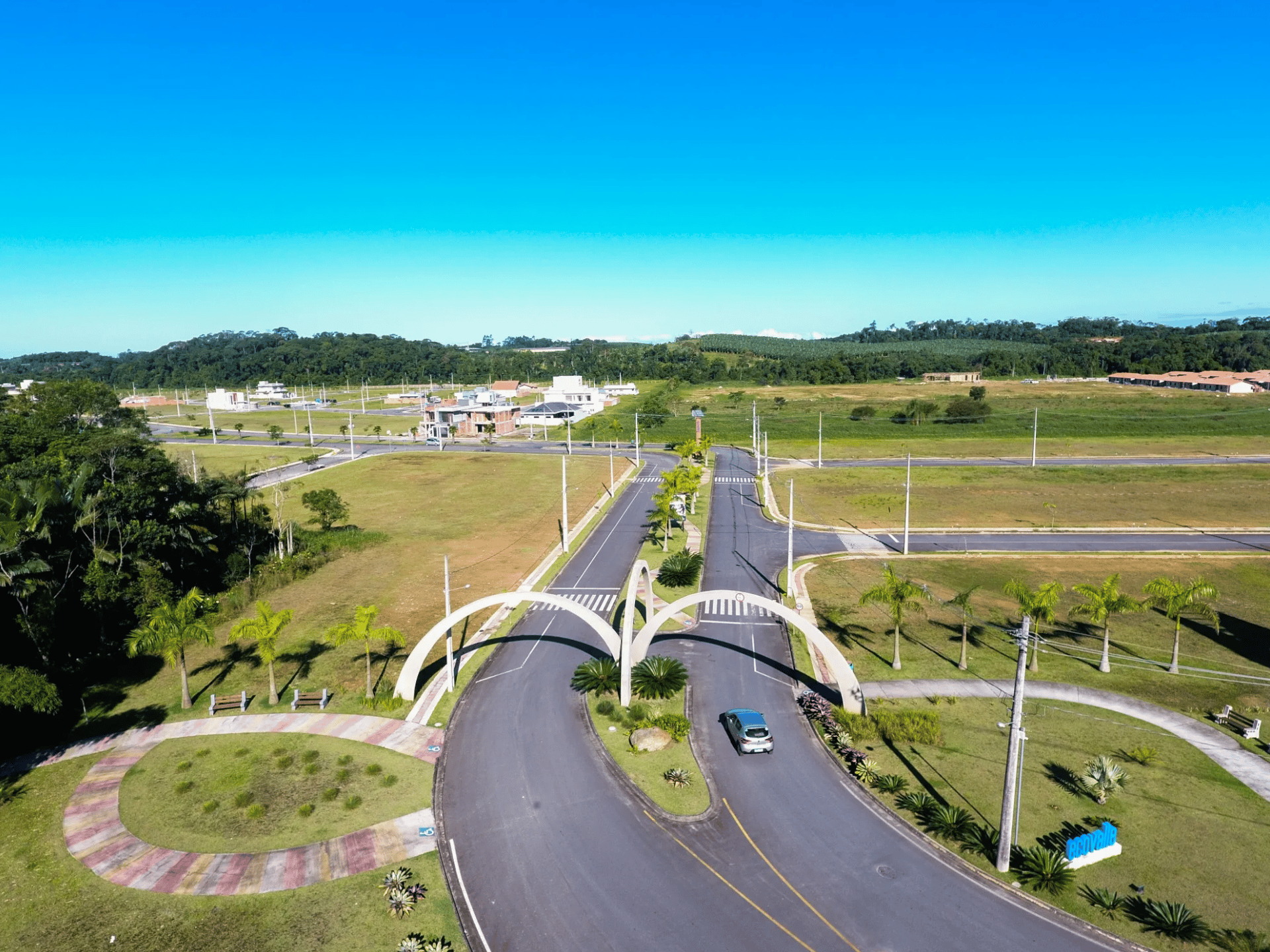 an abstract photo of a curved building with a blue sky in the background