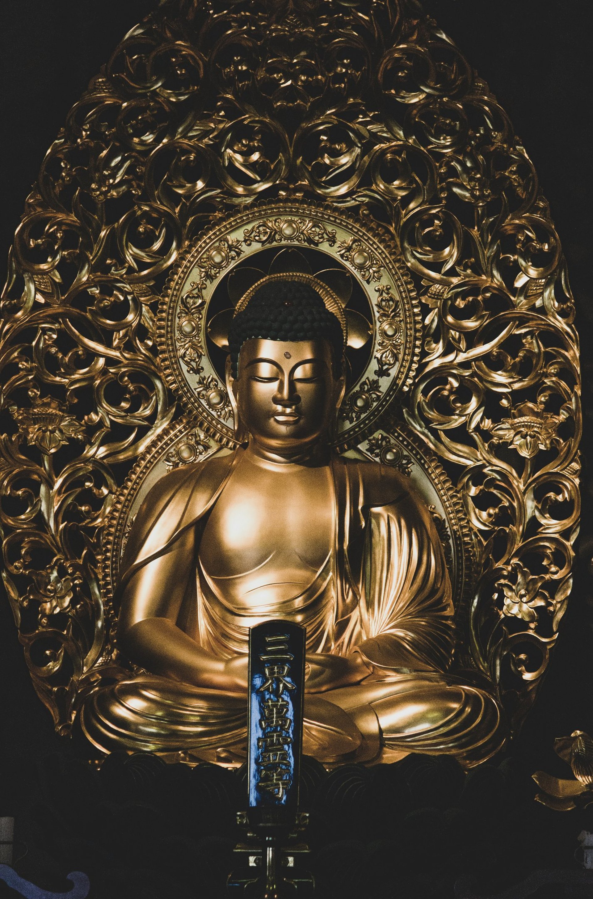 gold and black hindu deity figurine