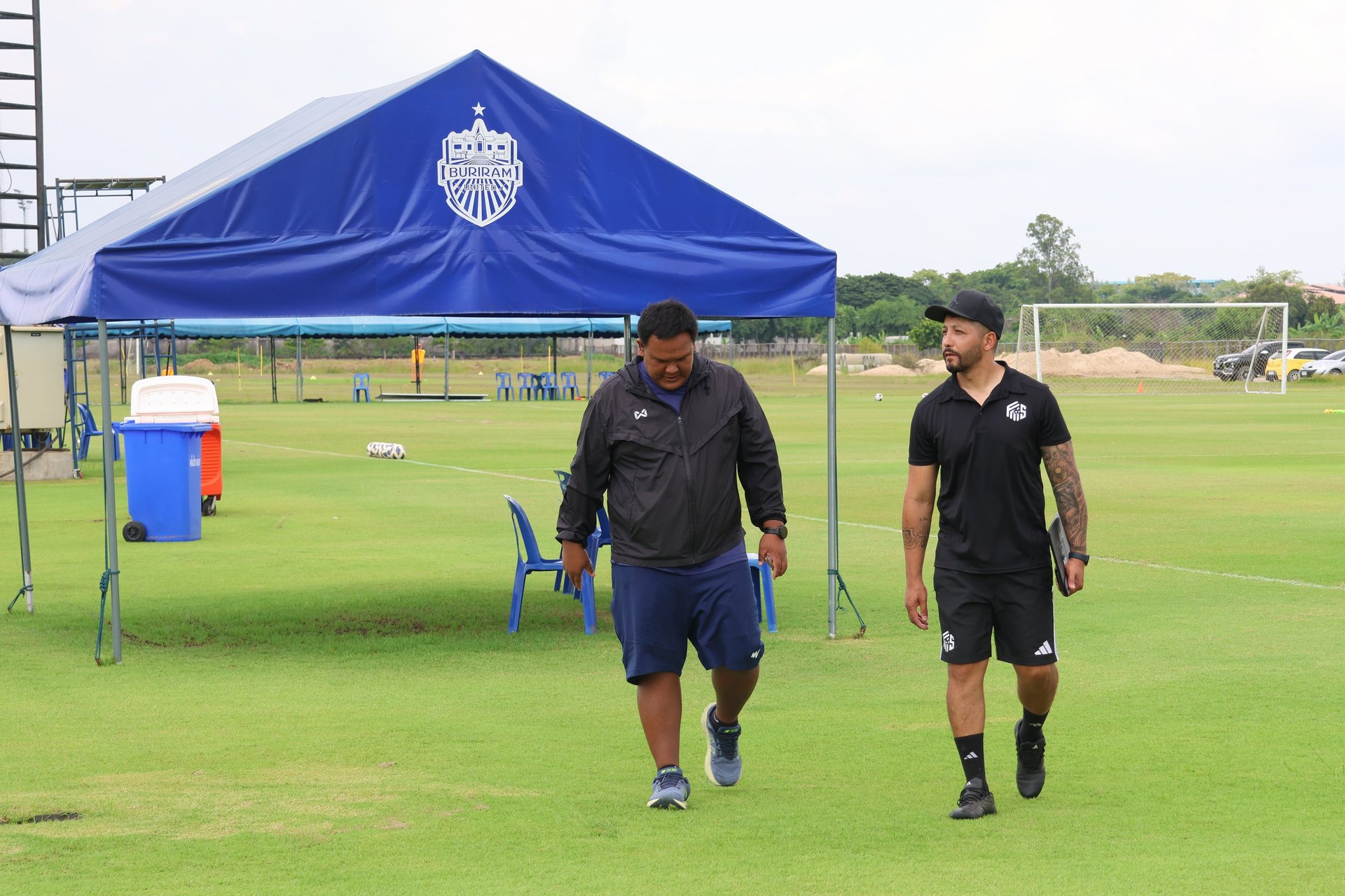 an abstract photo of a curved building with a blue sky in the background