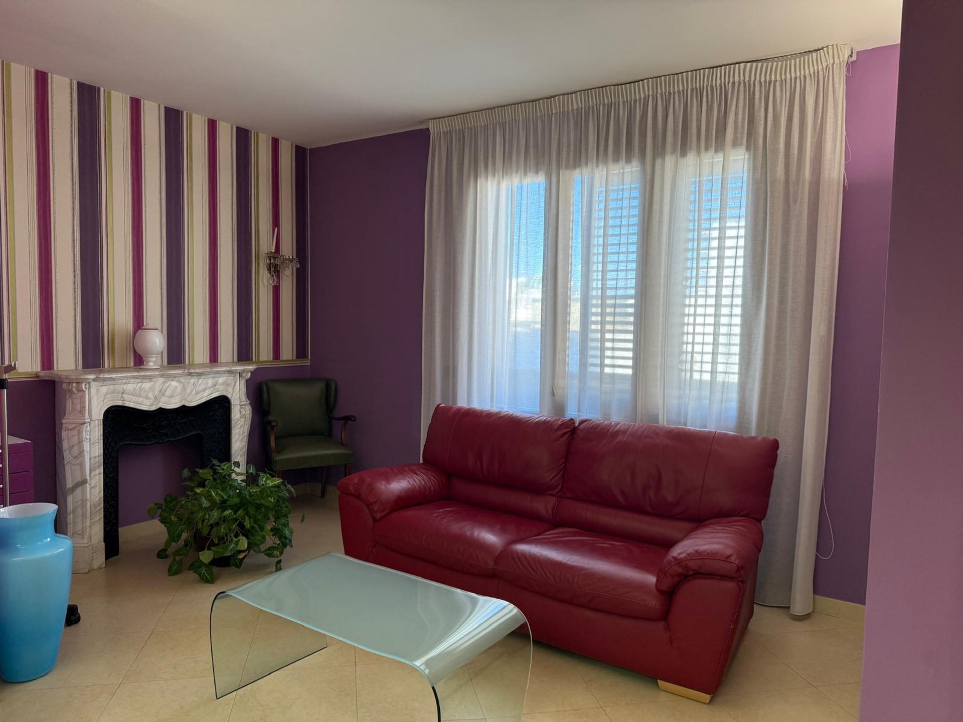 an abstract photo of a curved building with a blue sky in the background