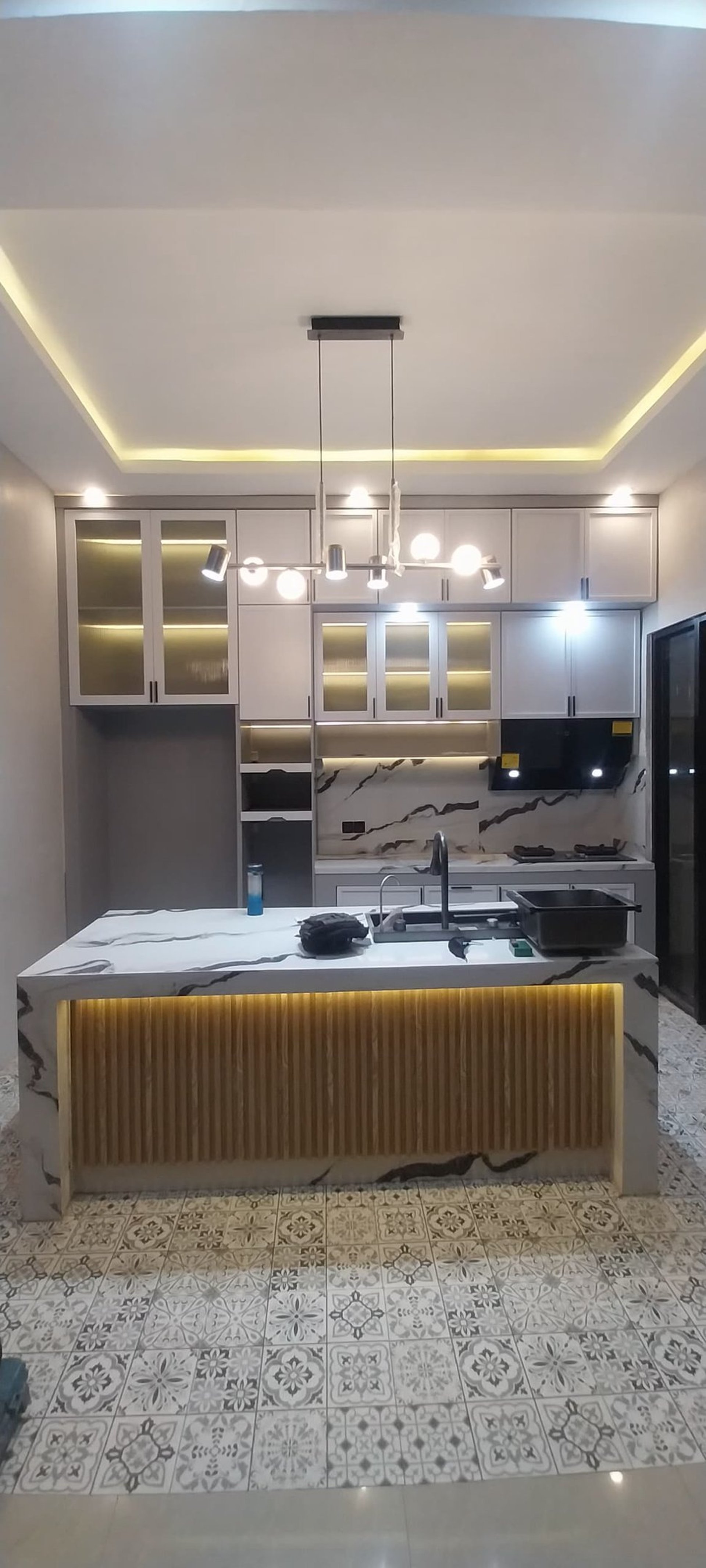 white wooden kitchen cabinet with black pendant lamp