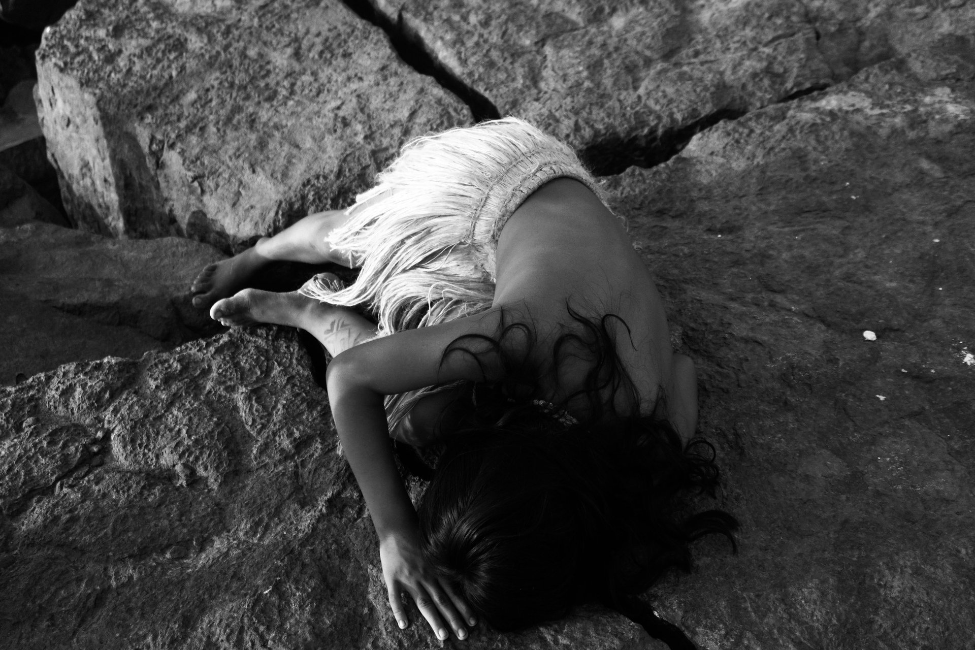 an abstract photo of a curved building with a blue sky in the background