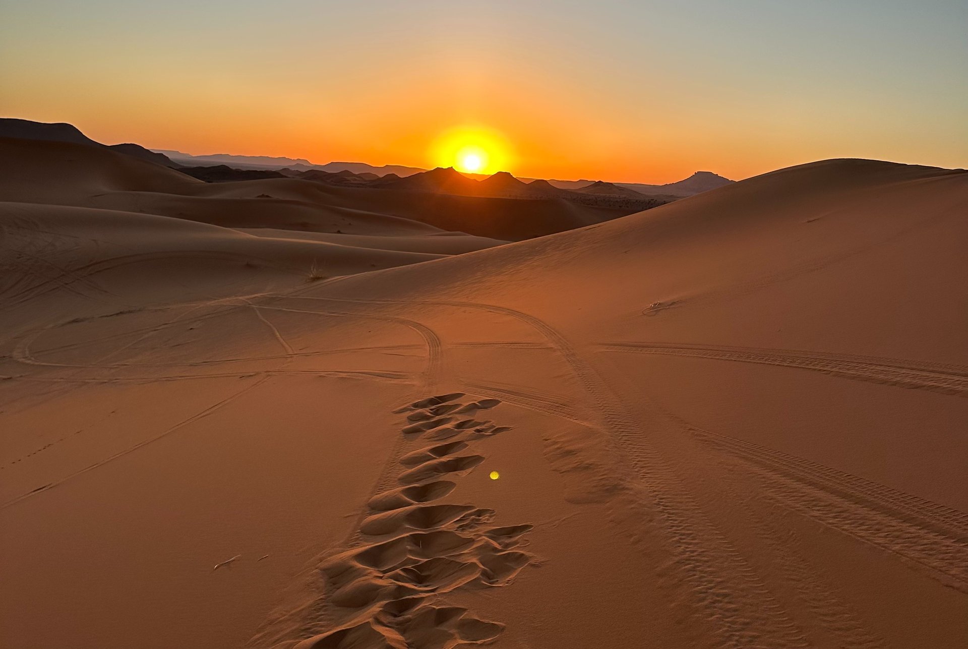 an abstract photo of a curved building with a blue sky in the background