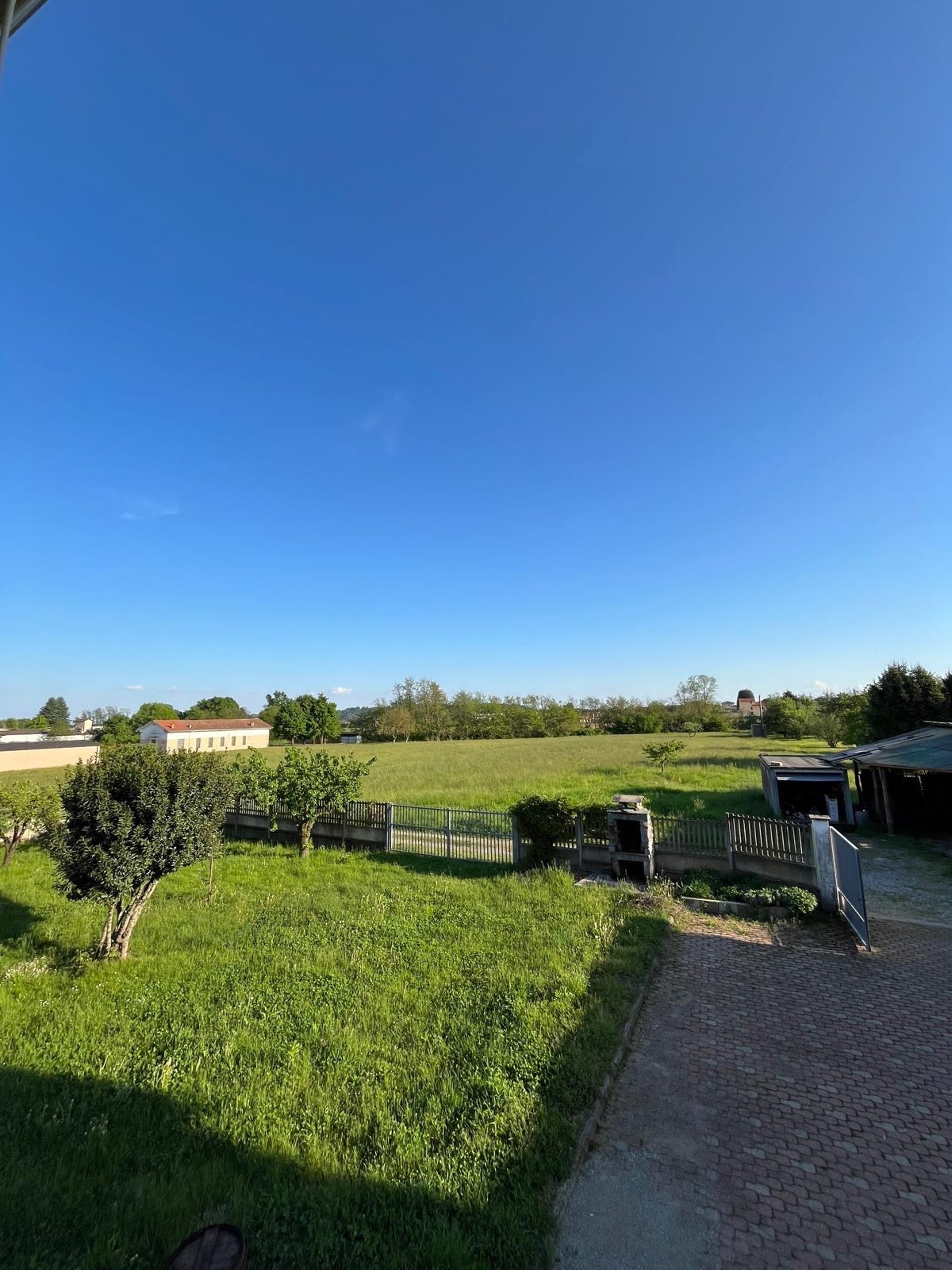 woman wearing yellow long-sleeved dress under white clouds and blue sky during daytime