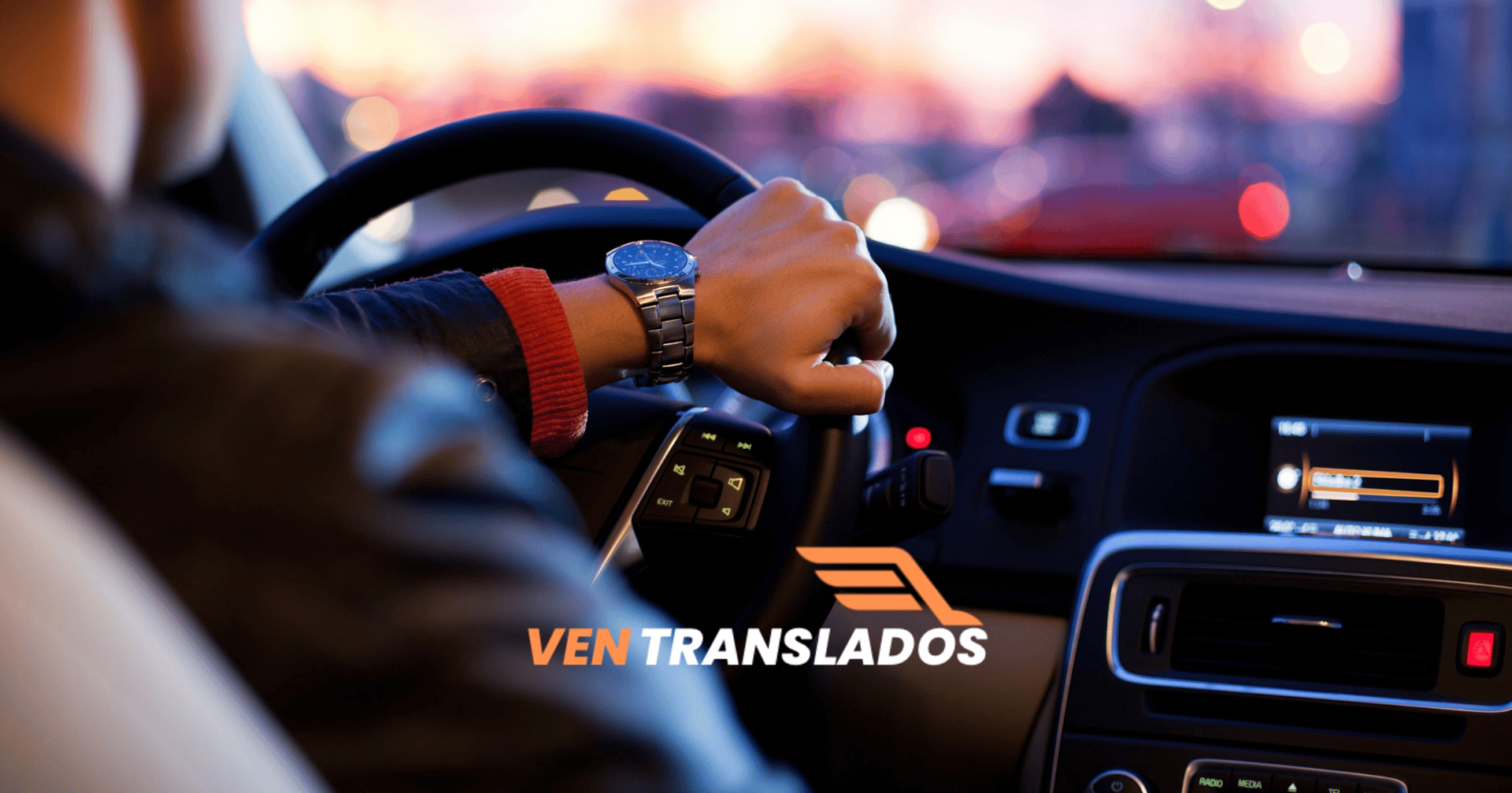 man driving a car wearing wrist watch