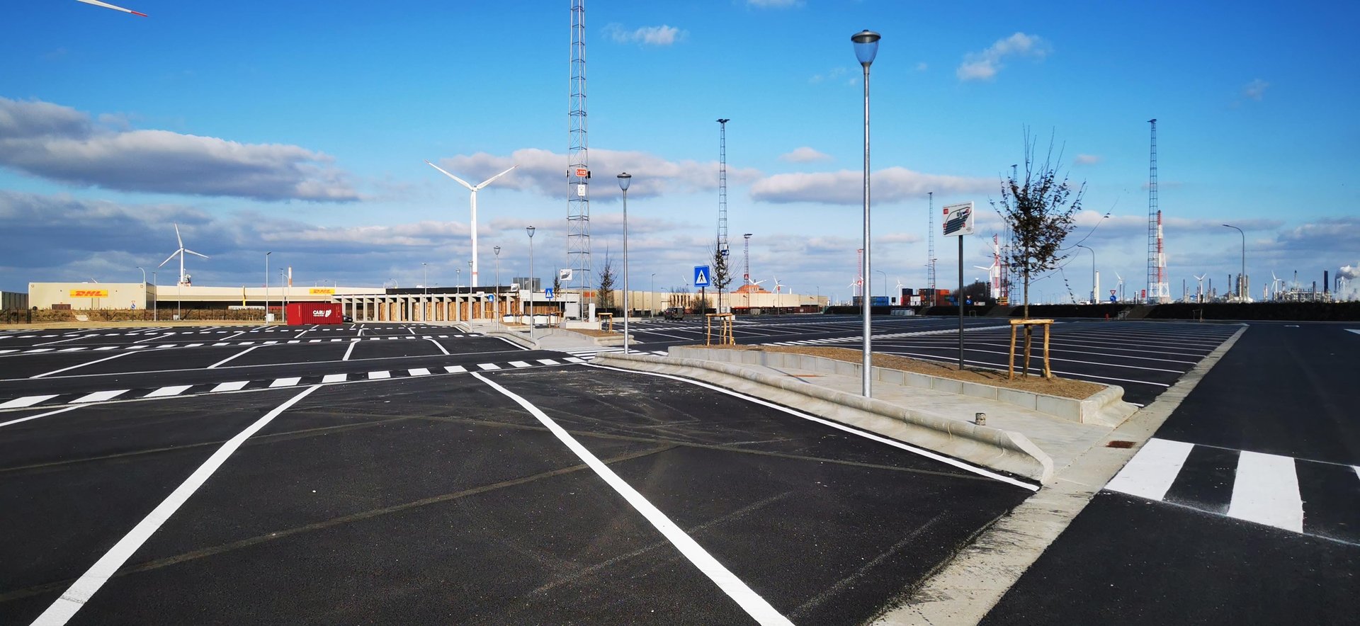 an abstract photo of a curved building with a blue sky in the background