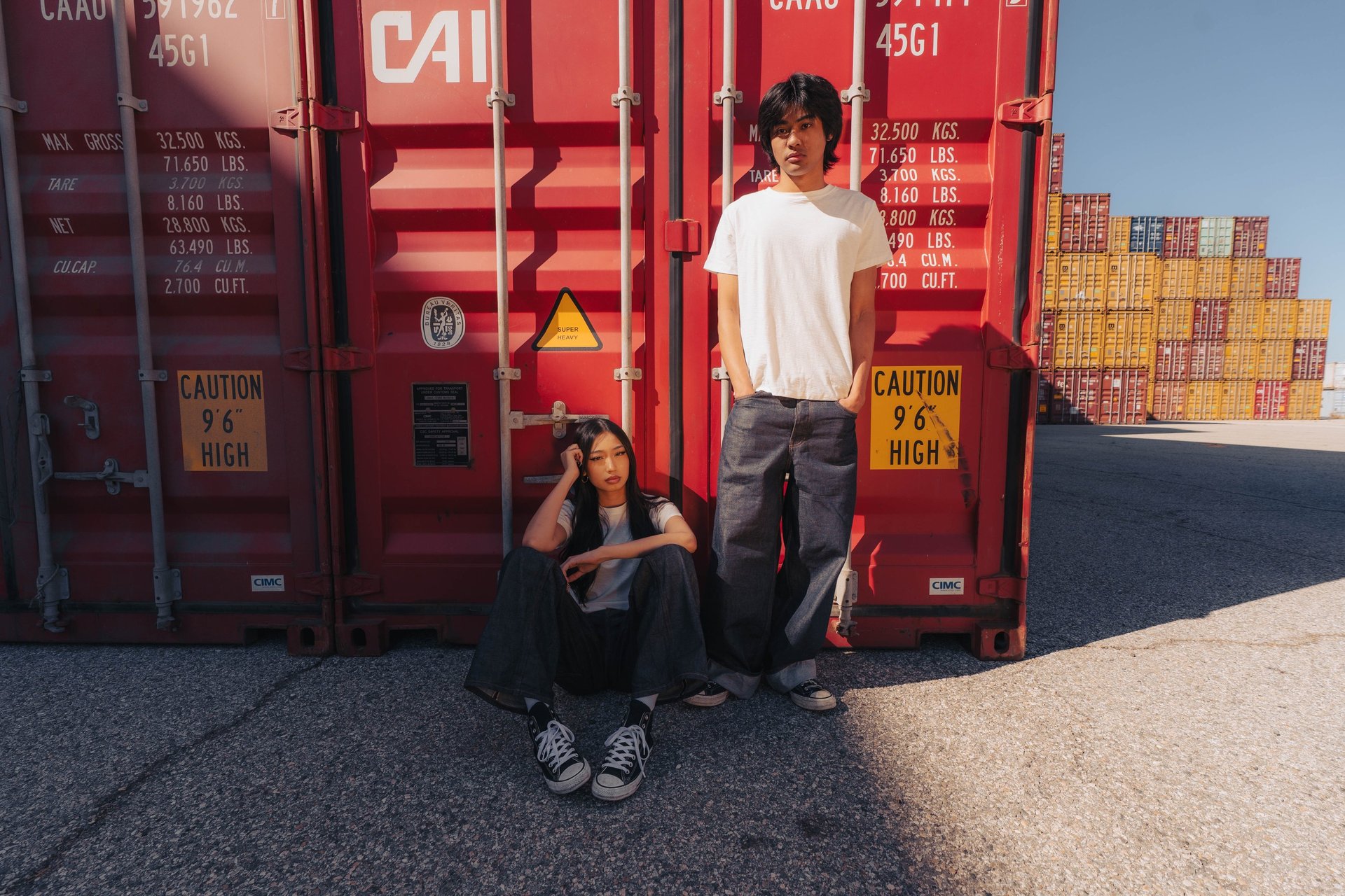 woman wearing yellow long-sleeved dress under white clouds and blue sky during daytime