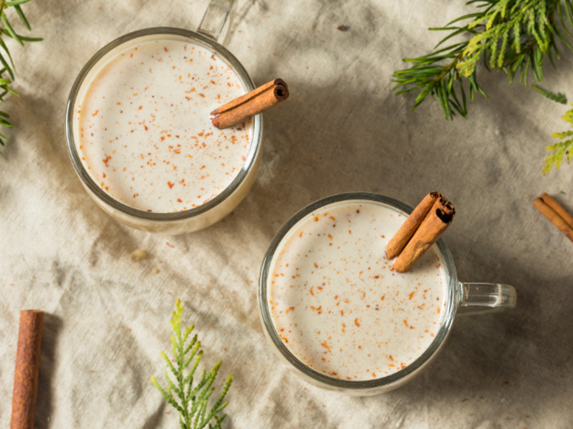 a narrow alley way with a colorful building and a flag on the door