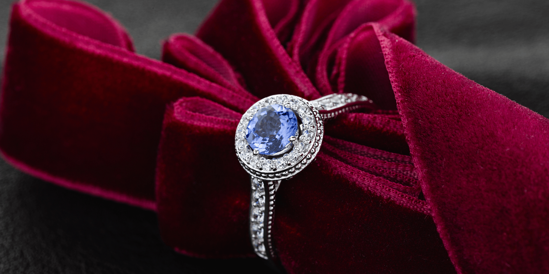 gold-colored and blue gemstone ring