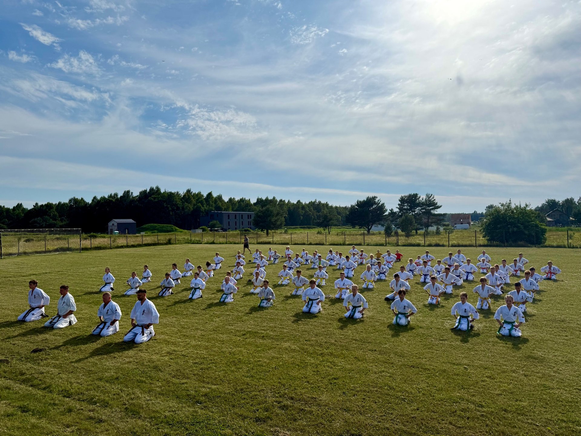 people in white and red uniform walking on red and white floor tiles