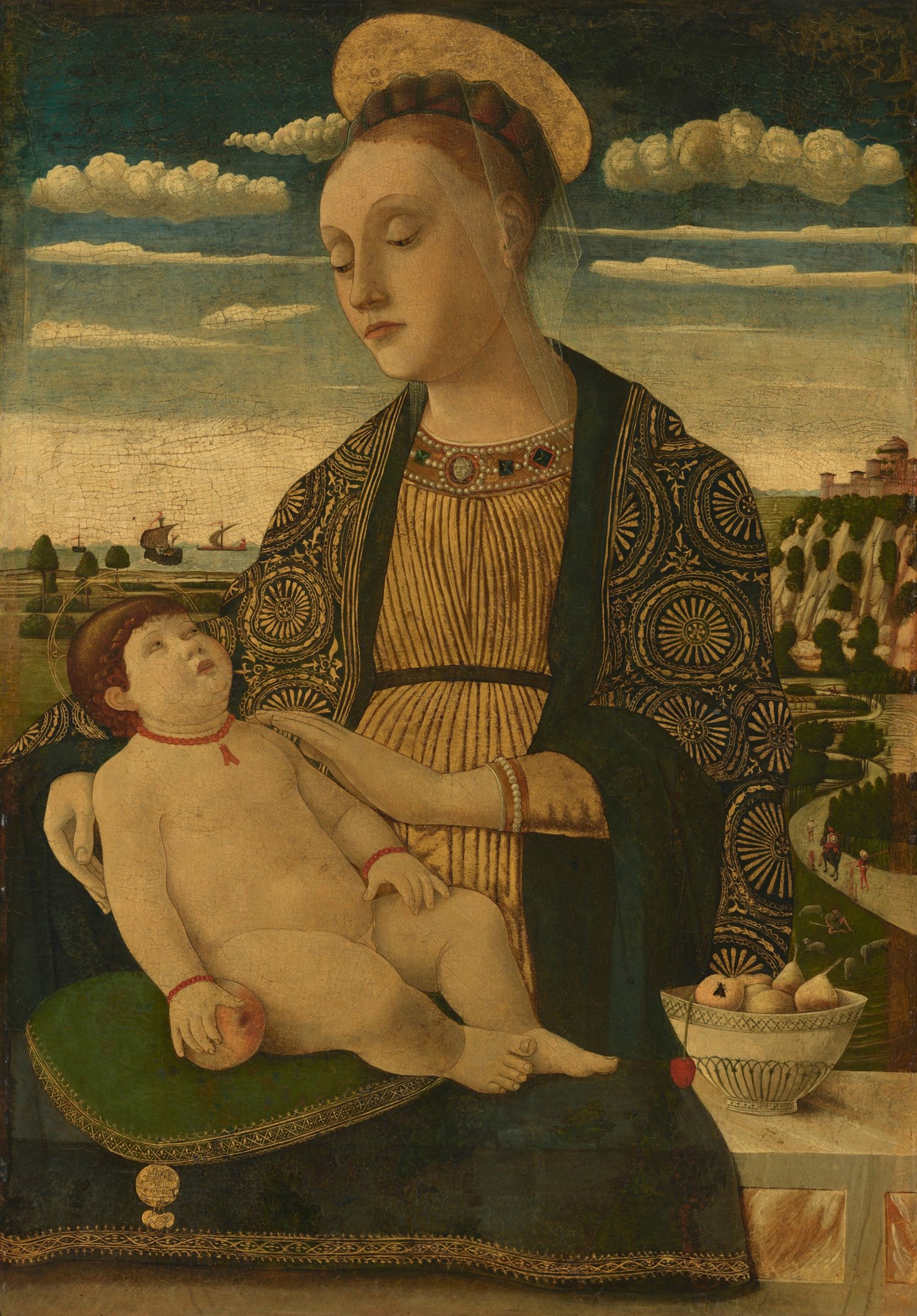 woman in green and brown dress holding baby painting