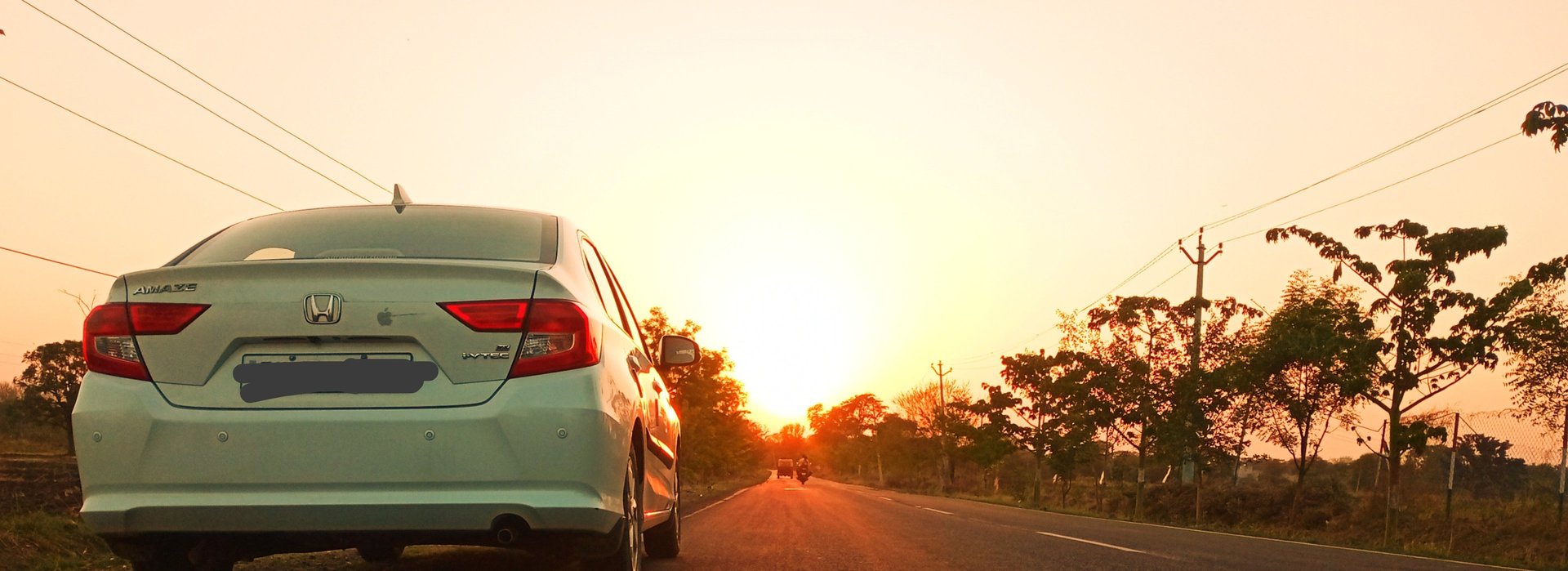 gray vehicle park on grass