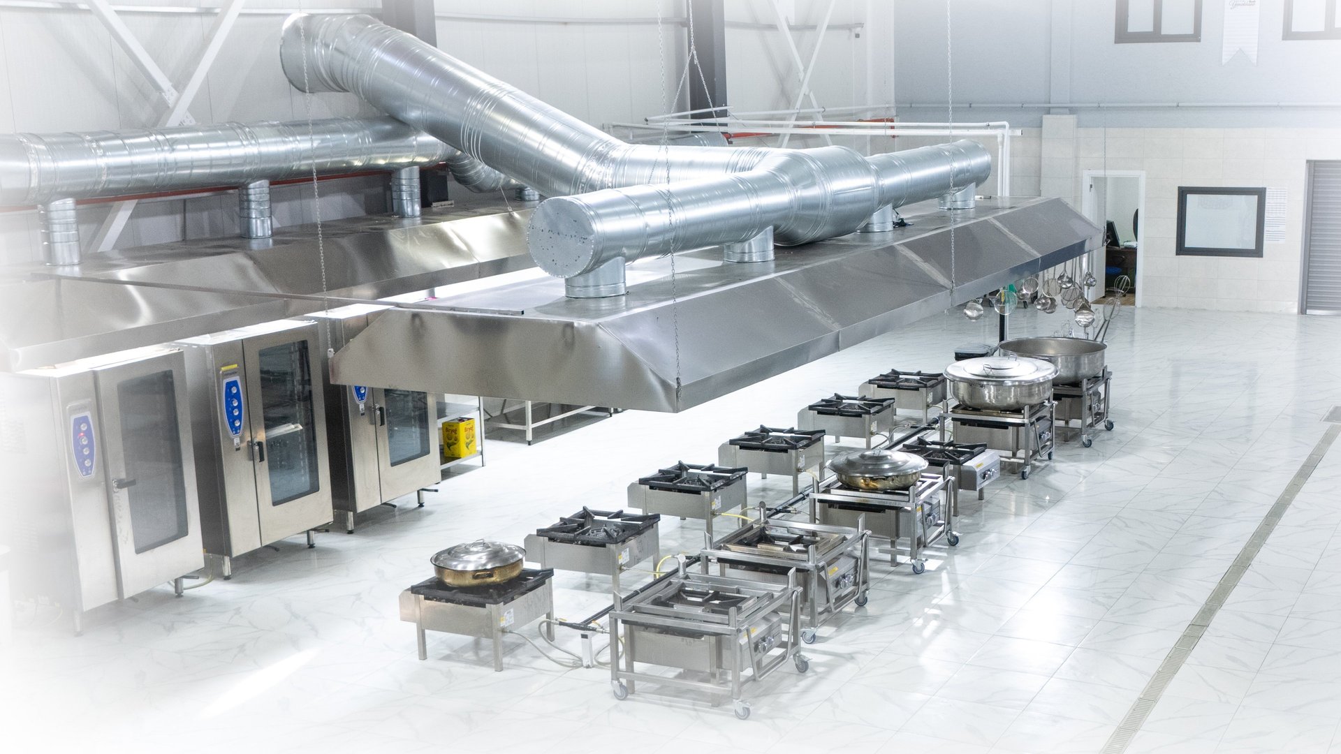 man in white chef uniform cooking