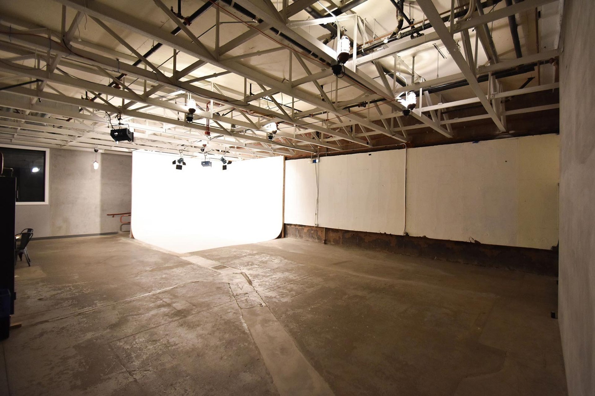 an abstract photo of a curved building with a blue sky in the background