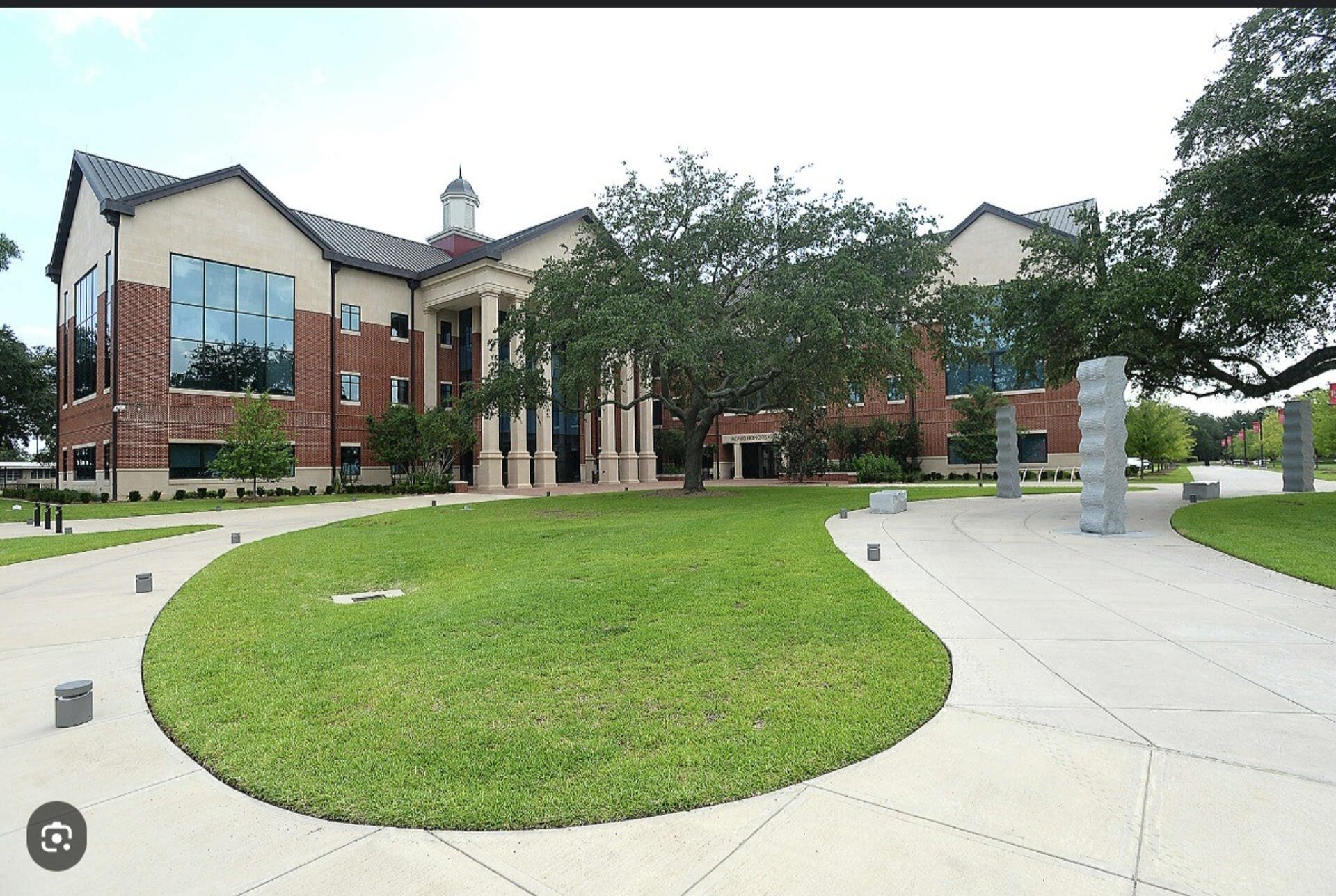 black and brown leather padded tub sofa