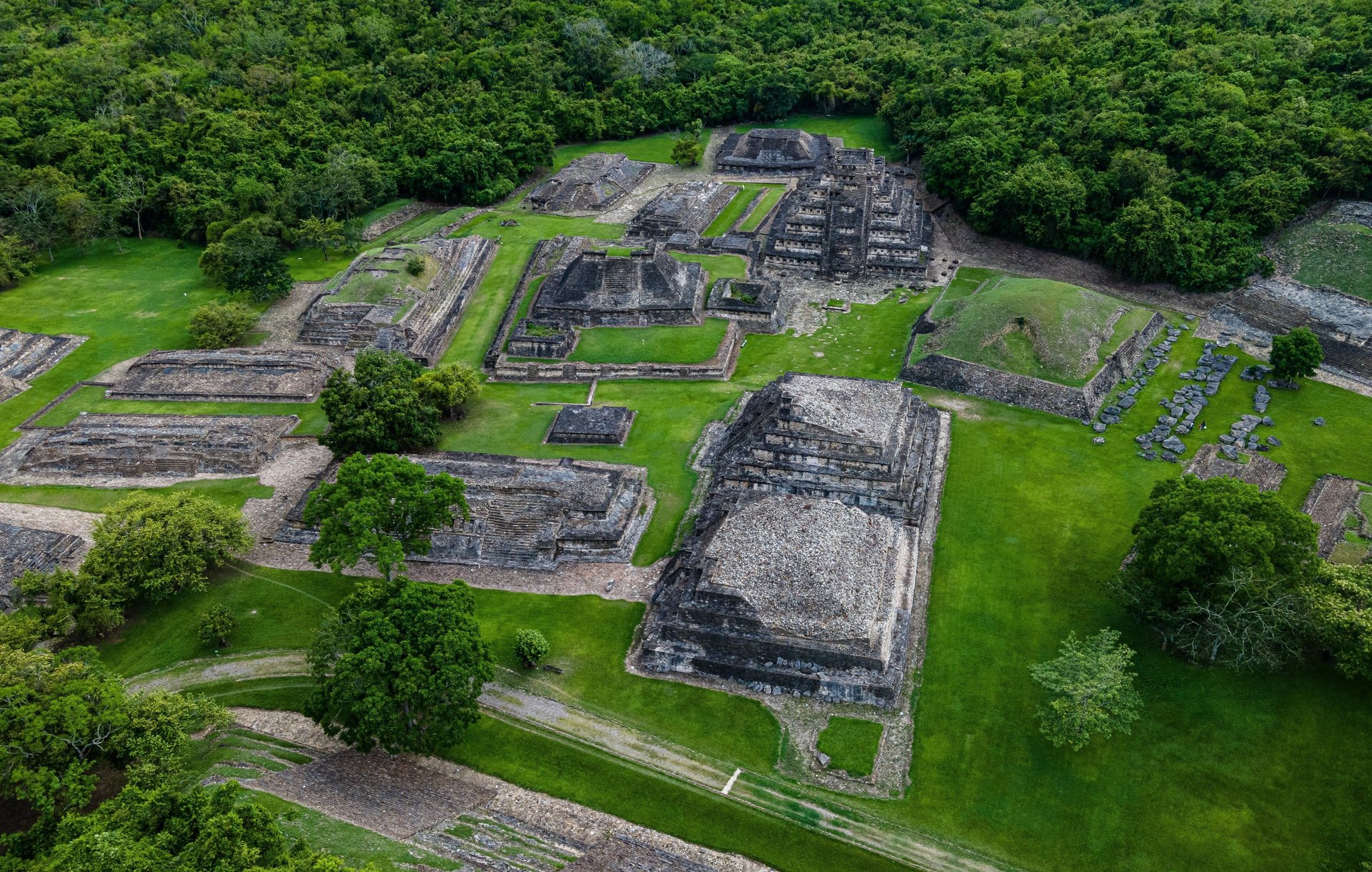 an abstract photo of a curved building with a blue sky in the background