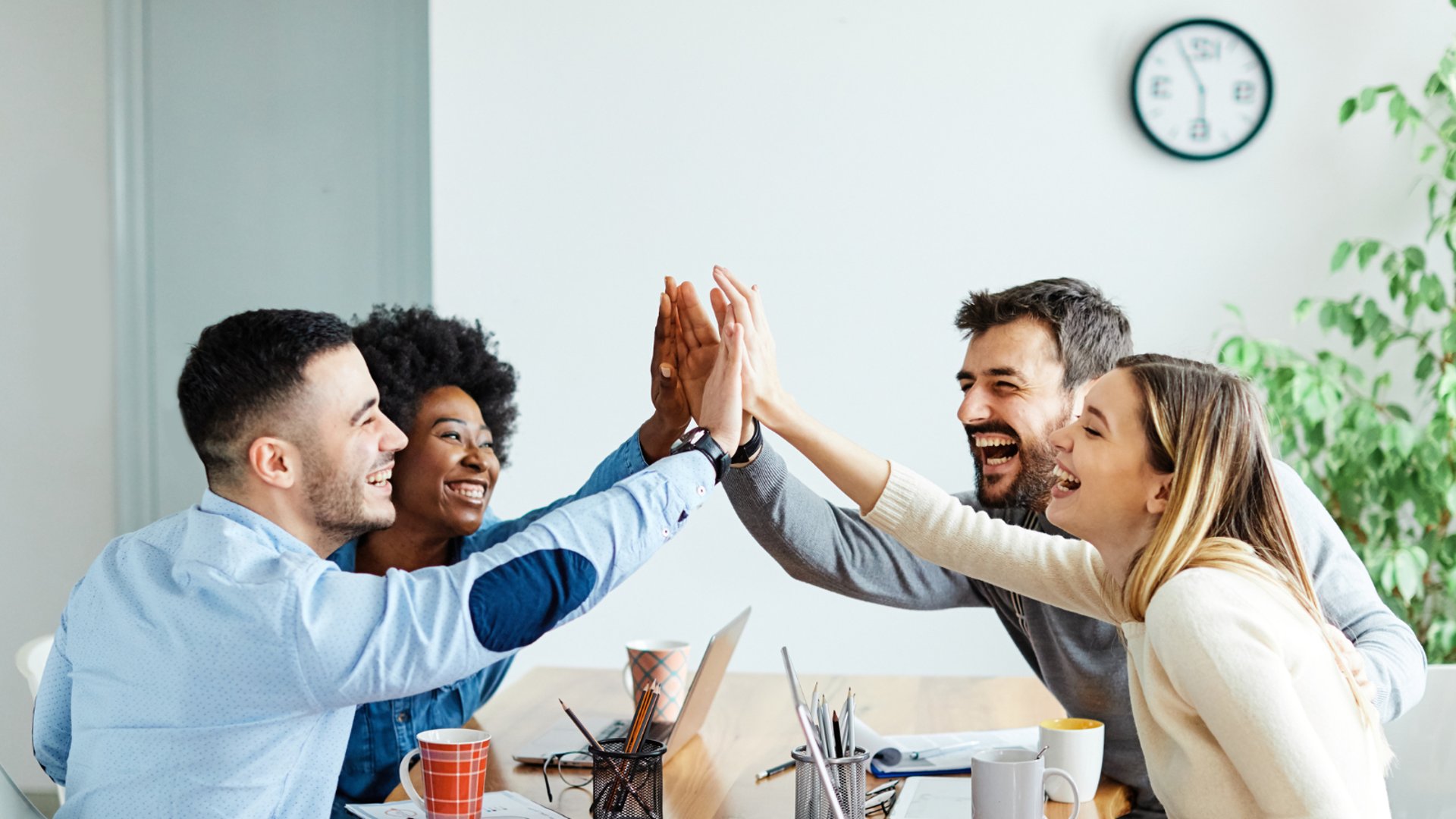 man in white dress shirt sitting beside woman in black long sleeve shirt