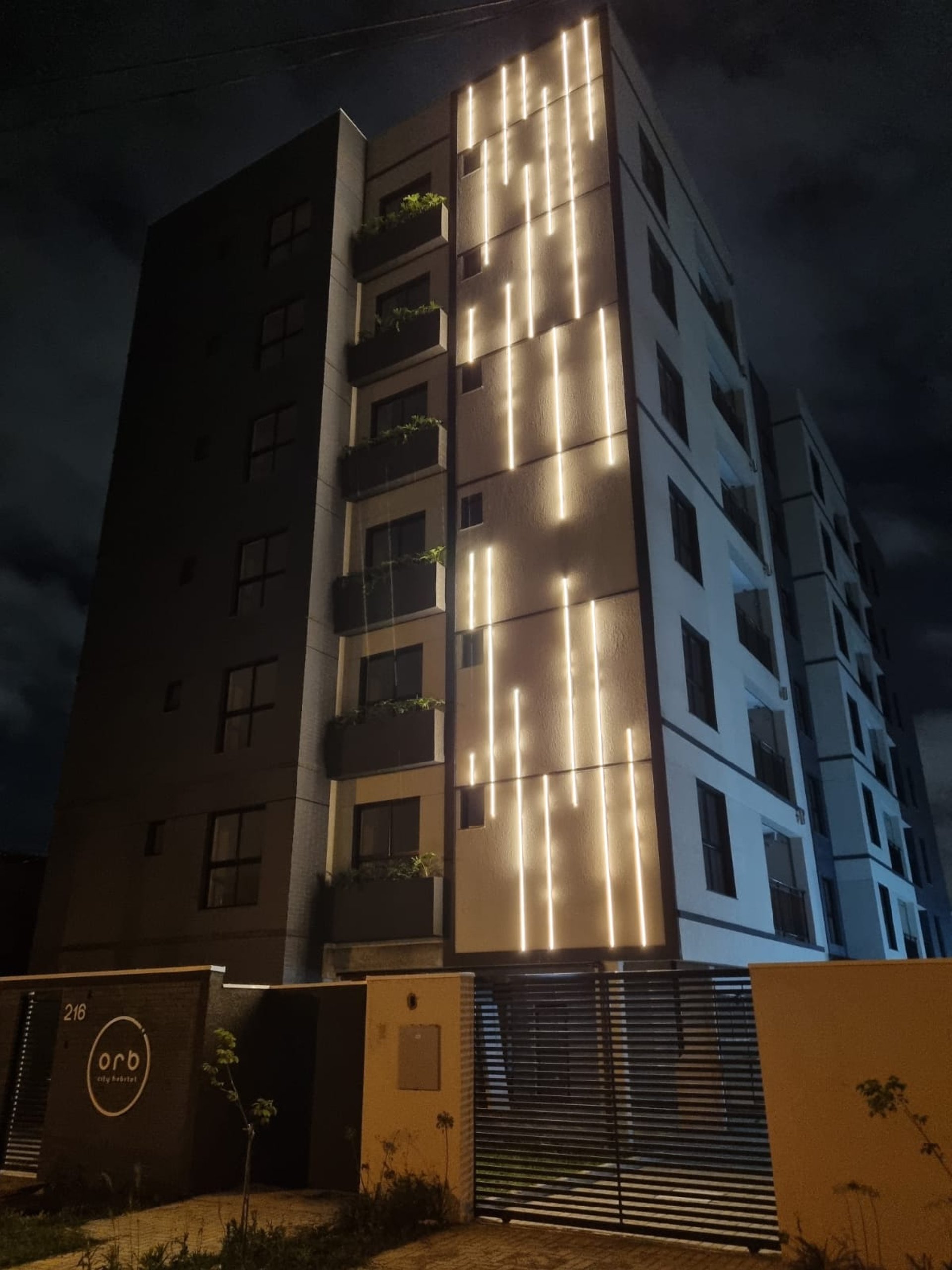 an abstract photo of a curved building with a blue sky in the background