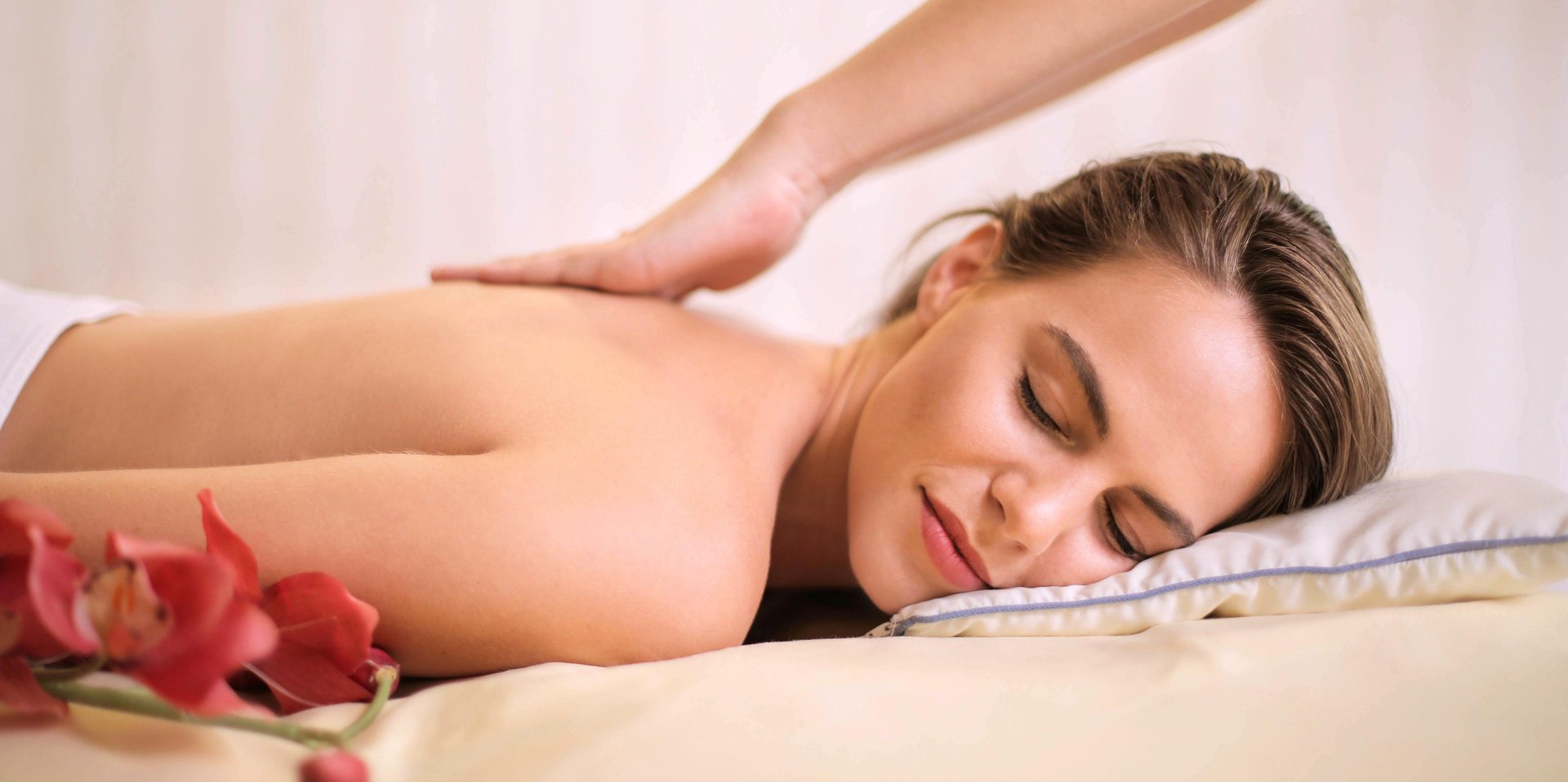 white and pink stone on brown wooden chopping board