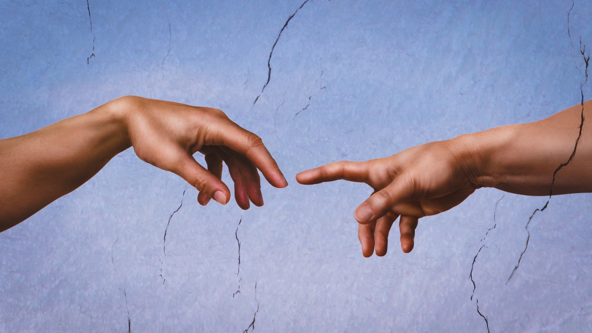 two hands reaching towards each other in the air