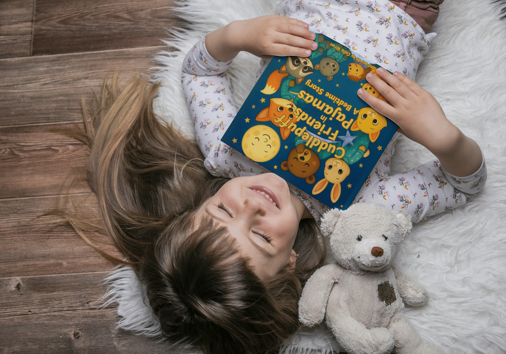 Mother and daughter reading a book in bed.