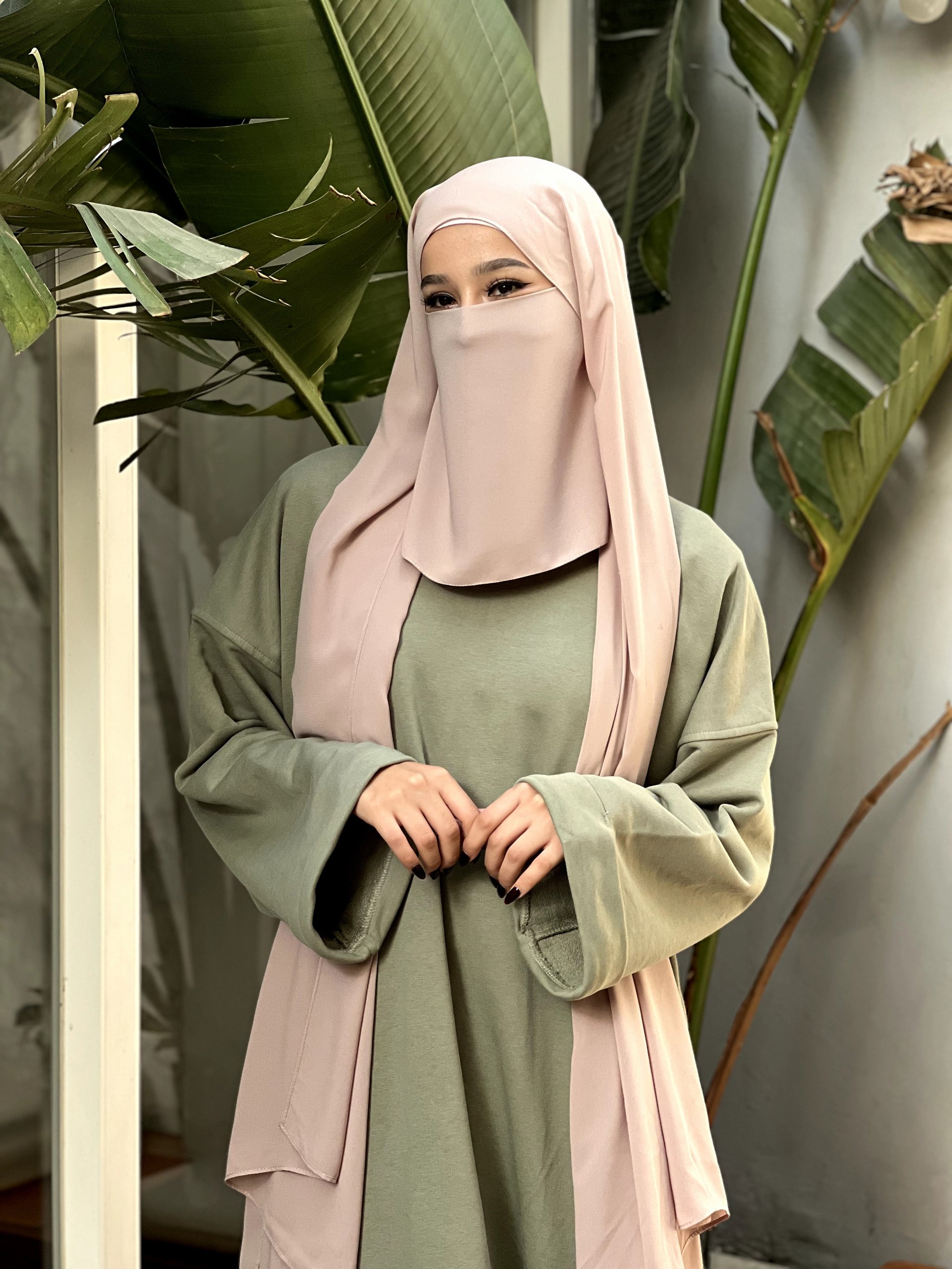 woman holding dried flower