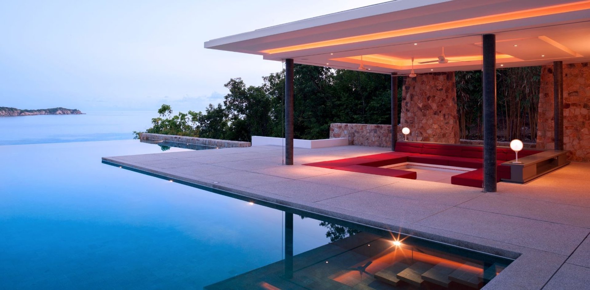 an abstract photo of a curved building with a blue sky in the background