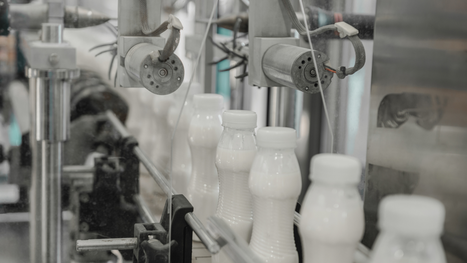 an abstract photo of a curved building with a blue sky in the background