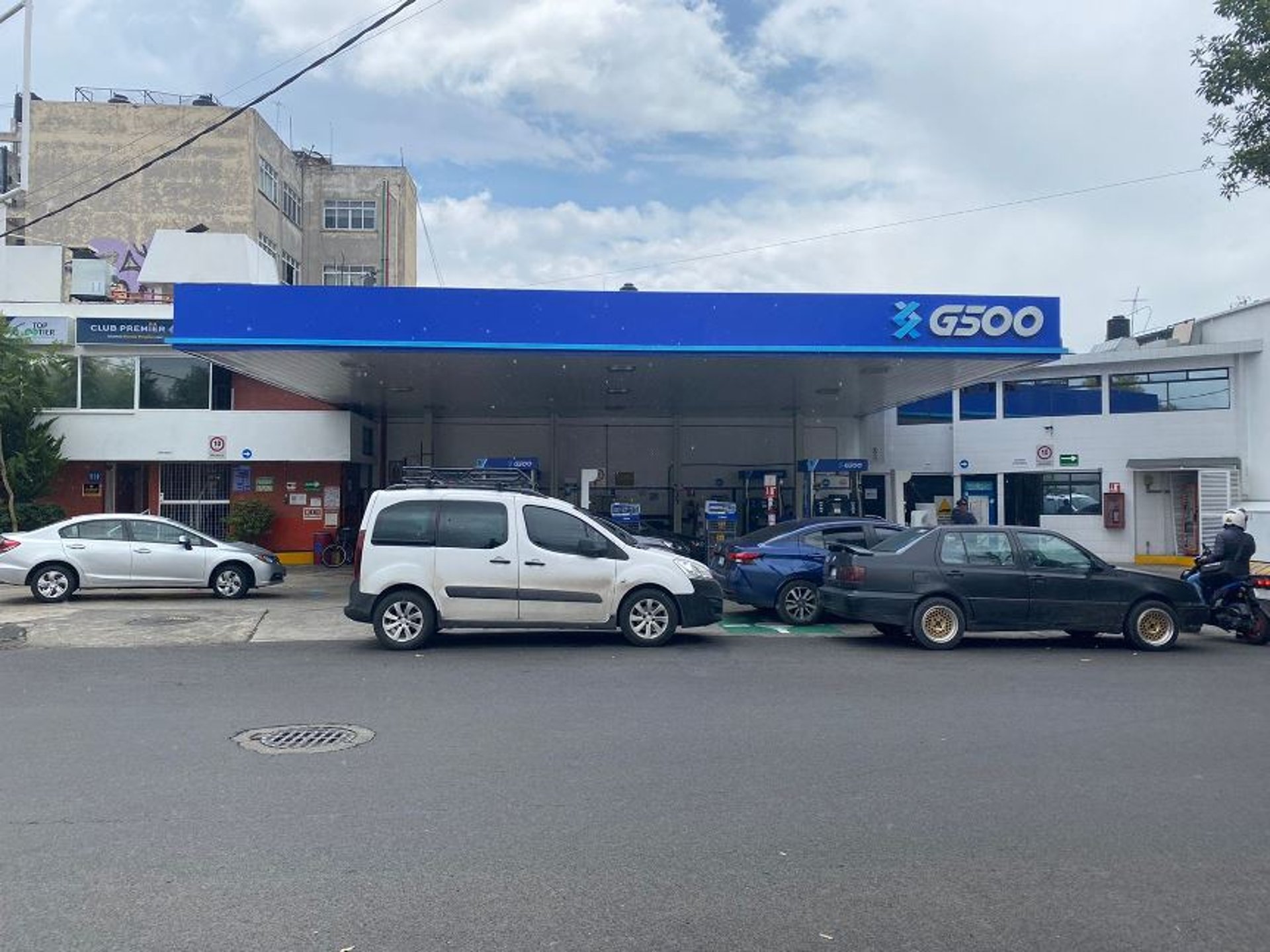 black and brown leather padded tub sofa