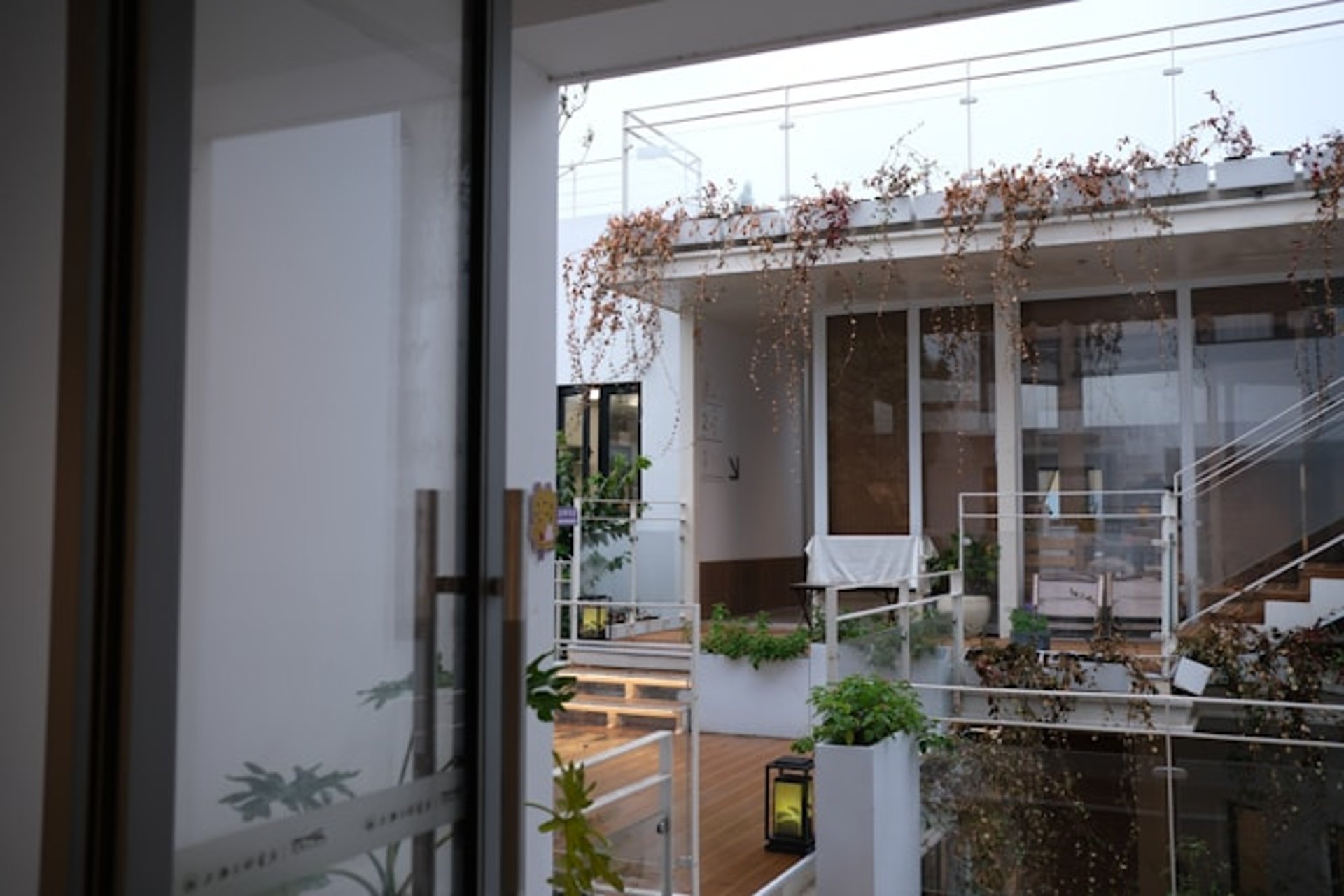 Modern apartment building with balconies and windows.