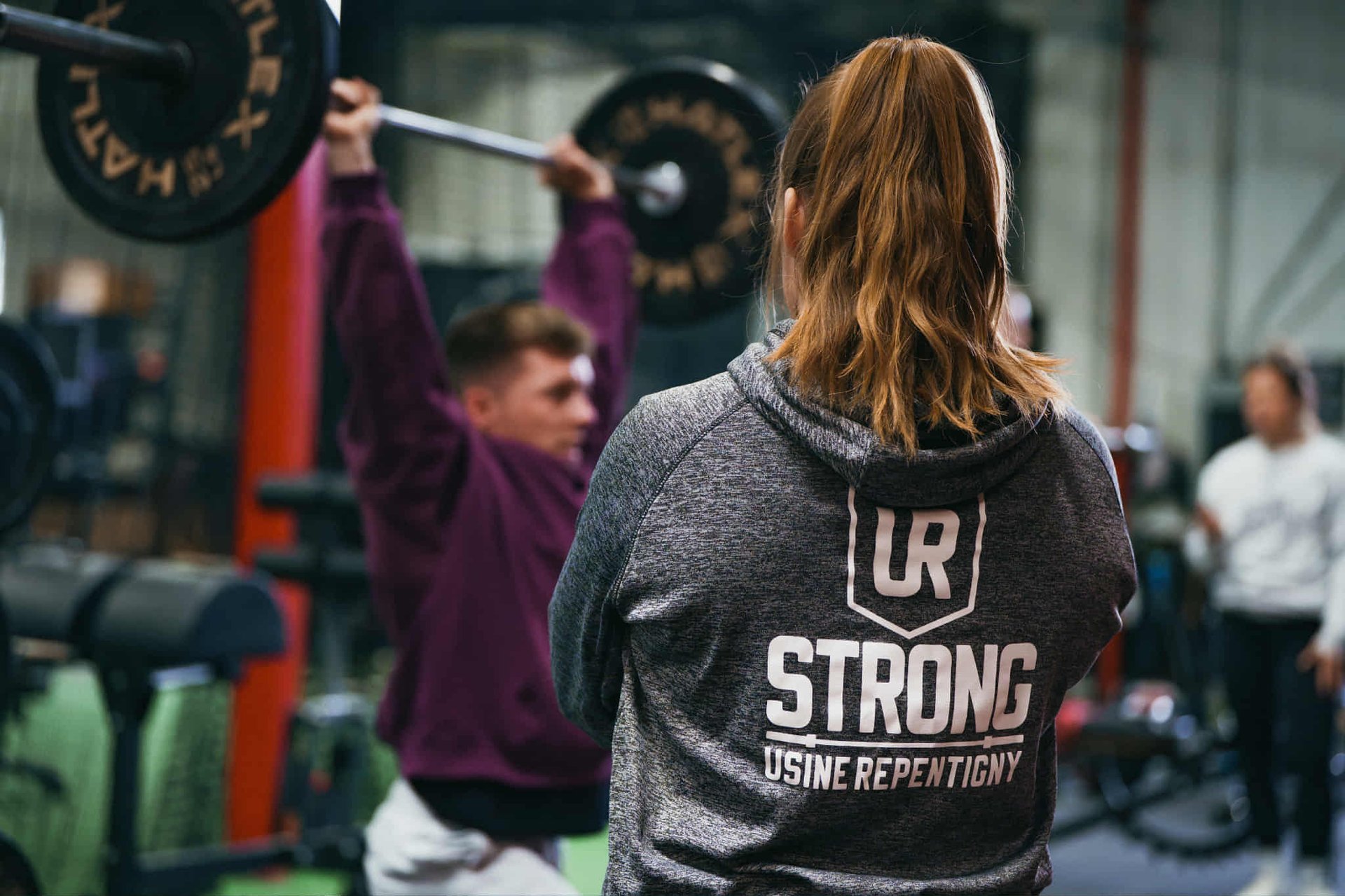 a close up of a person holding a doughnut